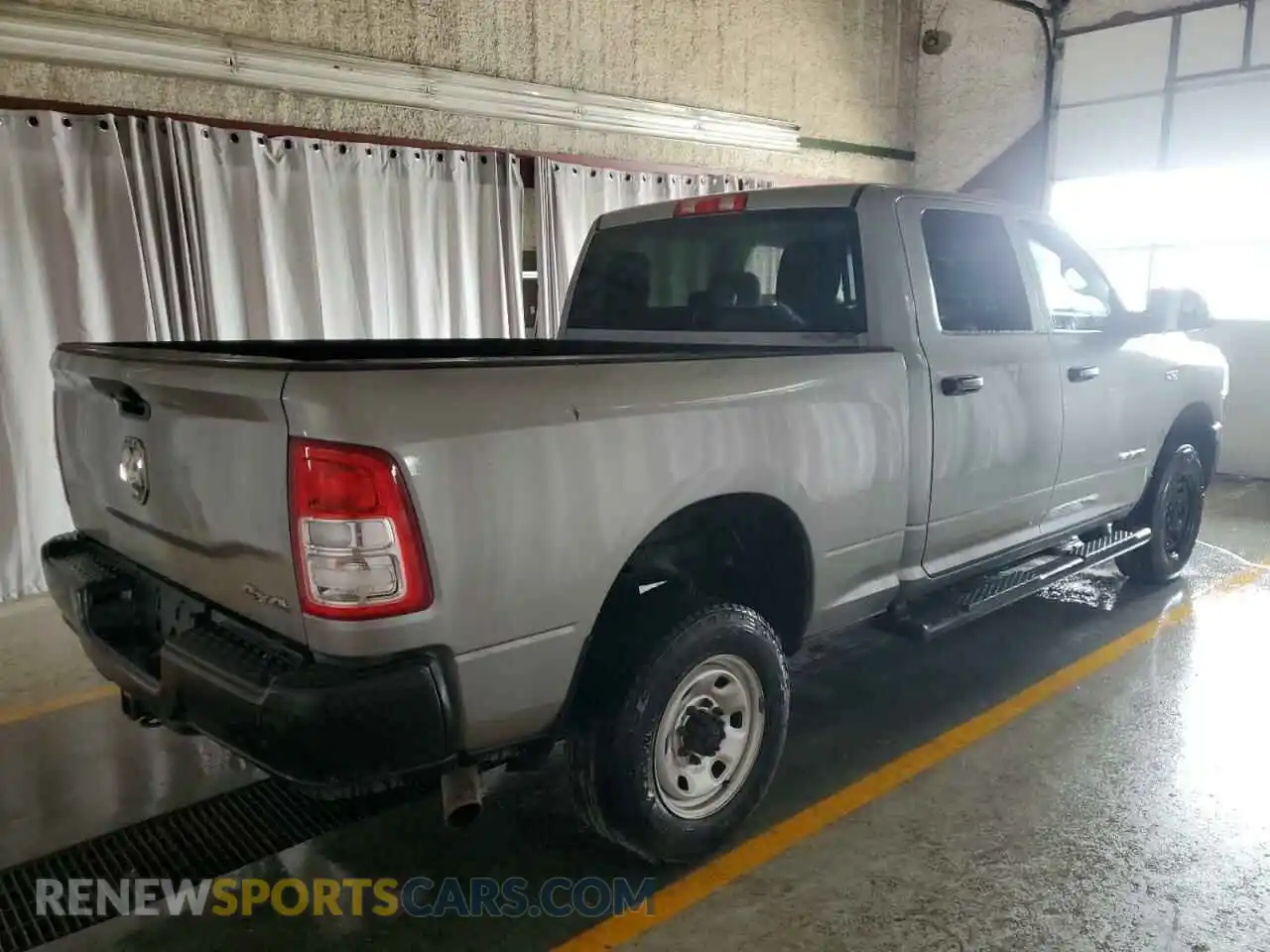3 Photograph of a damaged car 3C6UR5CJ1LG136332 RAM 2500 2020