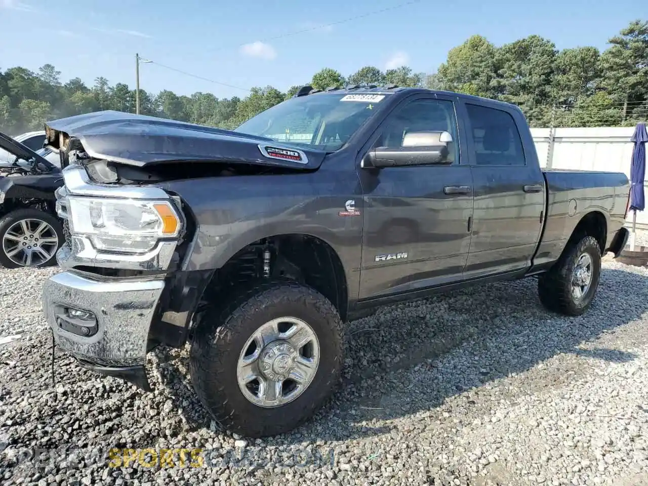 1 Photograph of a damaged car 3C6UR5CL3LG181709 RAM 2500 2020
