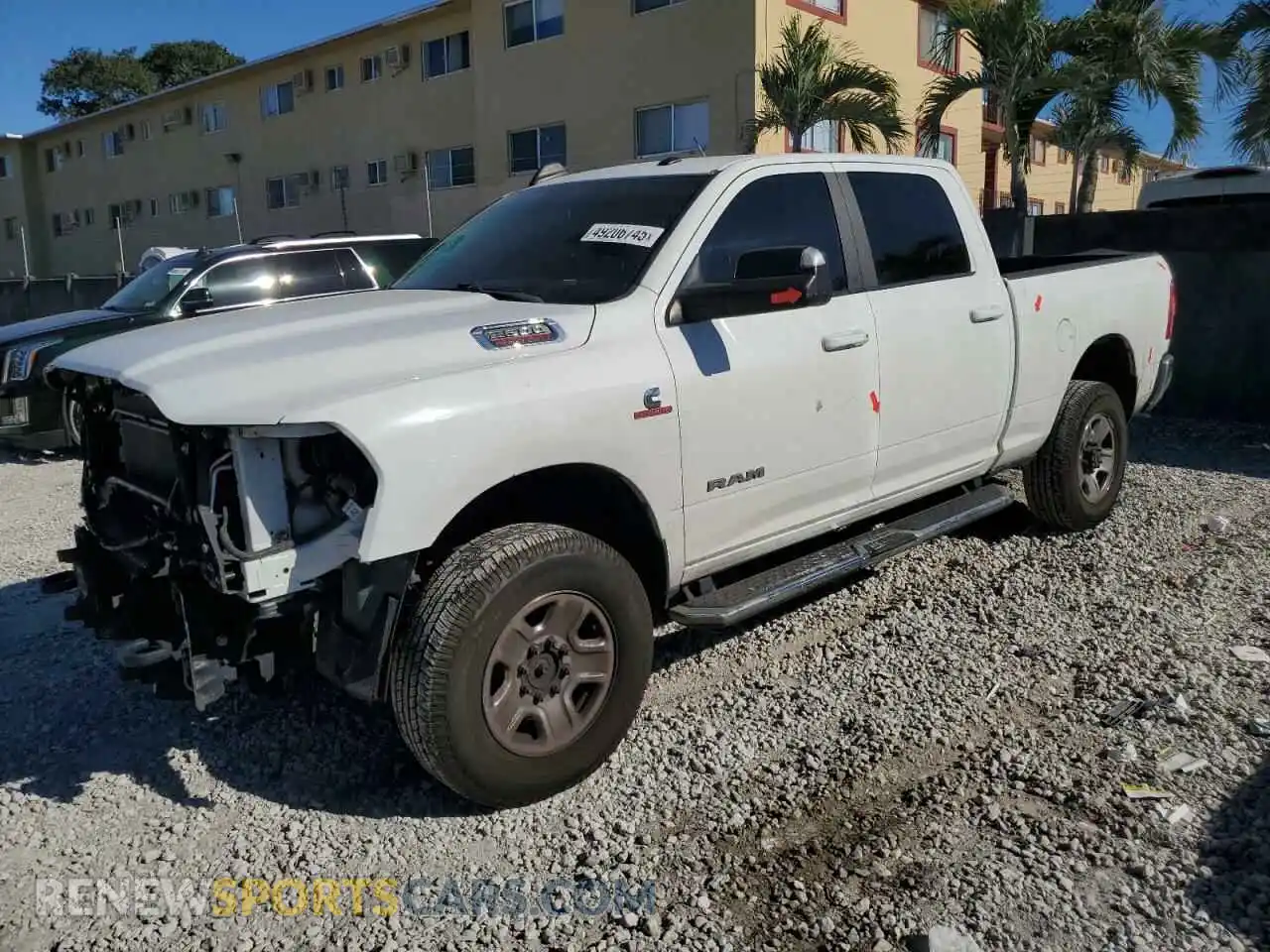 1 Photograph of a damaged car 3C6UR5DL0LG132708 RAM 2500 2020