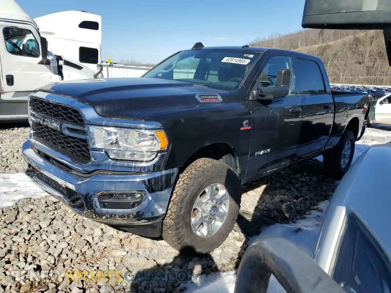 1 Photograph of a damaged car 3C6UR5DL1LG116386 RAM 2500 2020