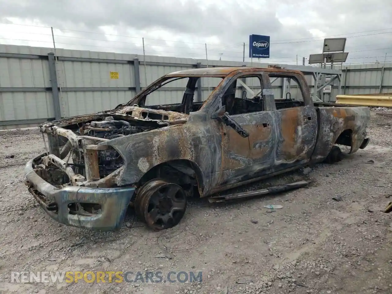 1 Photograph of a damaged car 3C6UR5DL3LG119077 RAM 2500 2020