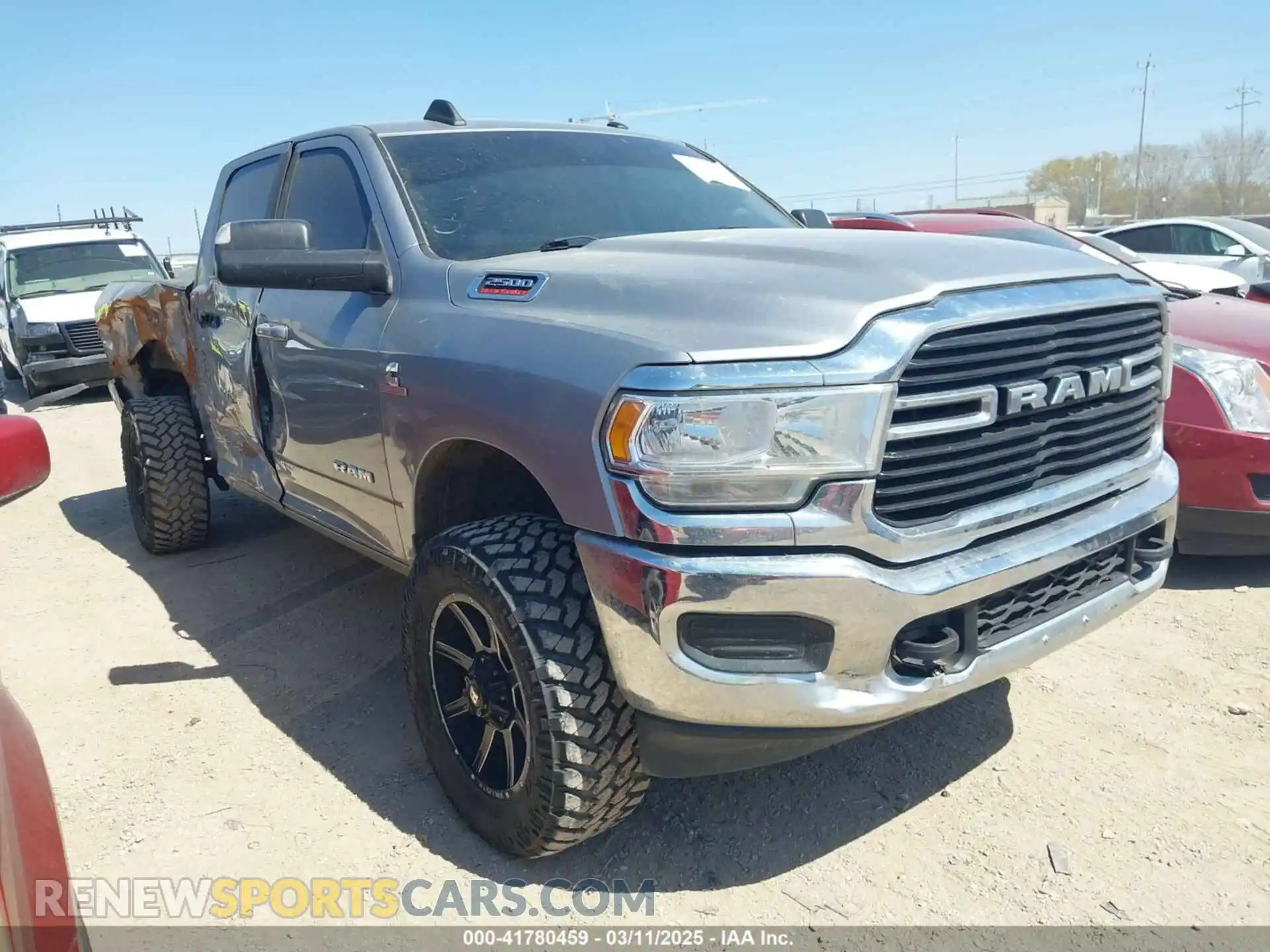 1 Photograph of a damaged car 3C6UR5DL3LG141225 RAM 2500 2020