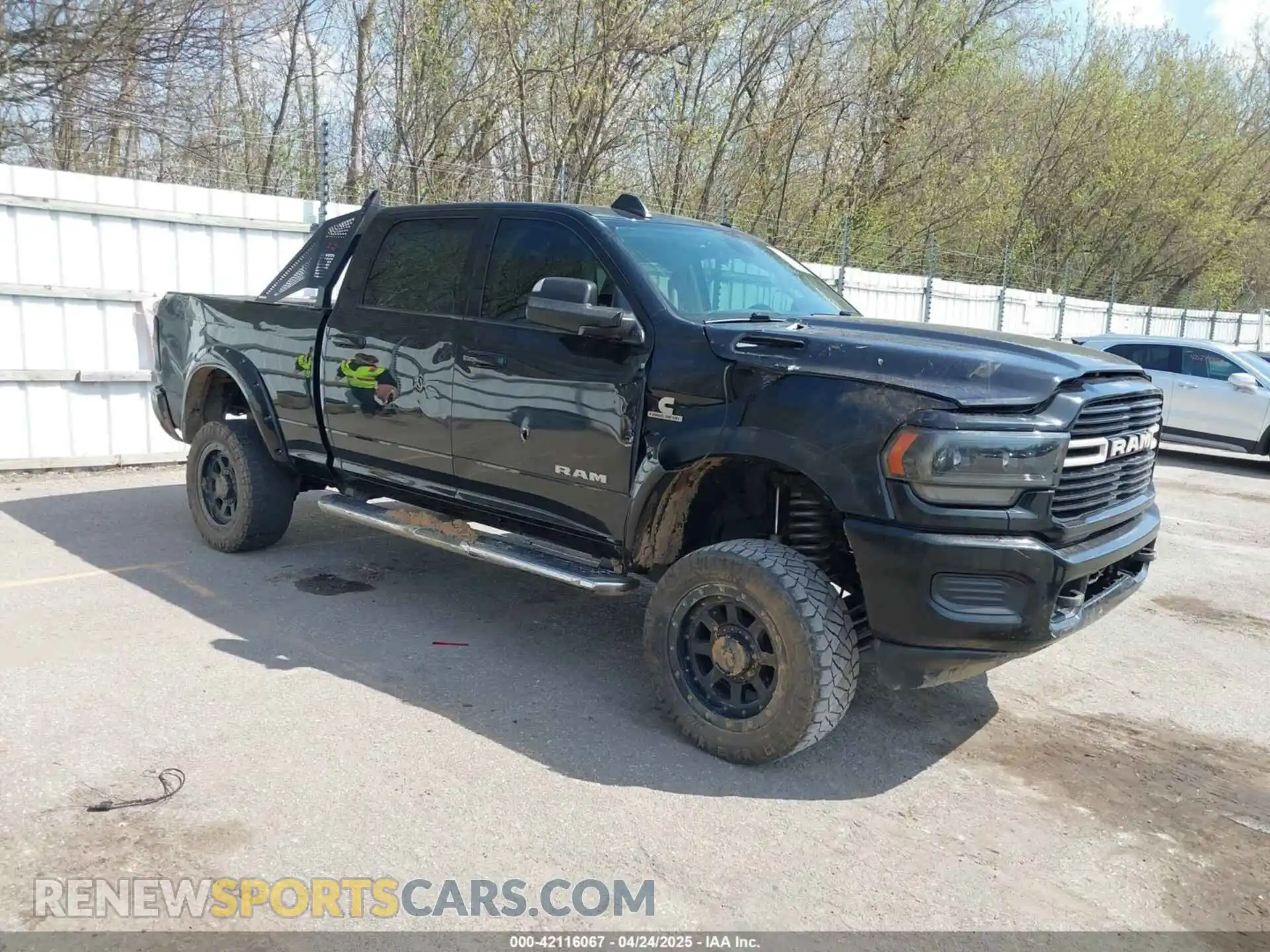1 Photograph of a damaged car 3C6UR5DL6LG116741 RAM 2500 2020