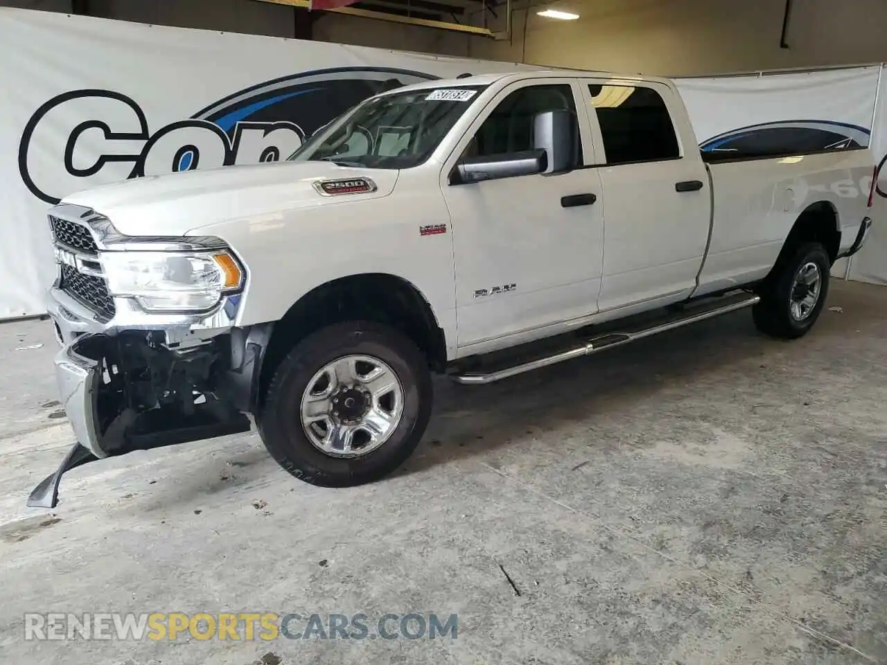 1 Photograph of a damaged car 3C6UR5HJ1LG111844 RAM 2500 2020