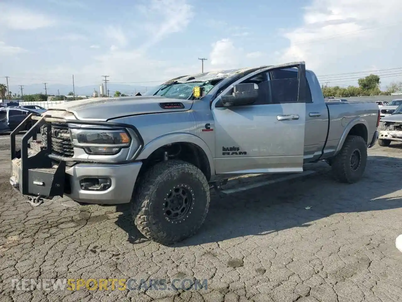 1 Photograph of a damaged car 3C6UR5NL8LG274089 RAM 2500 2020