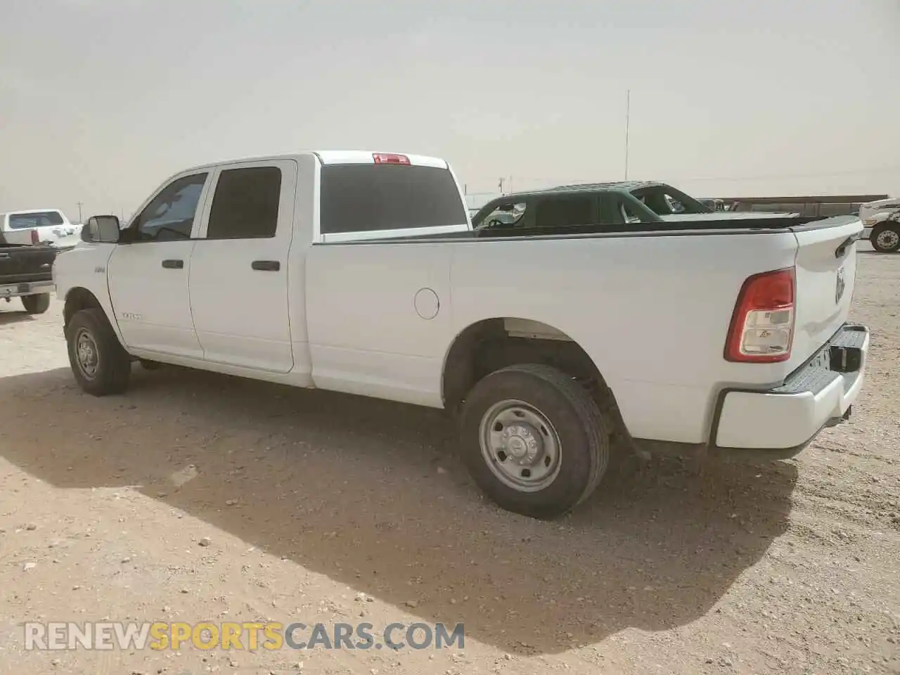 2 Photograph of a damaged car 3C6UR4HJ9MG674085 RAM 2500 2021