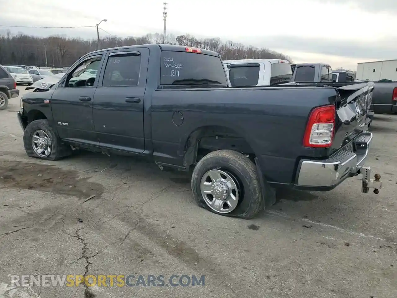 2 Photograph of a damaged car 3C6UR5CJ2MG561219 RAM 2500 2021