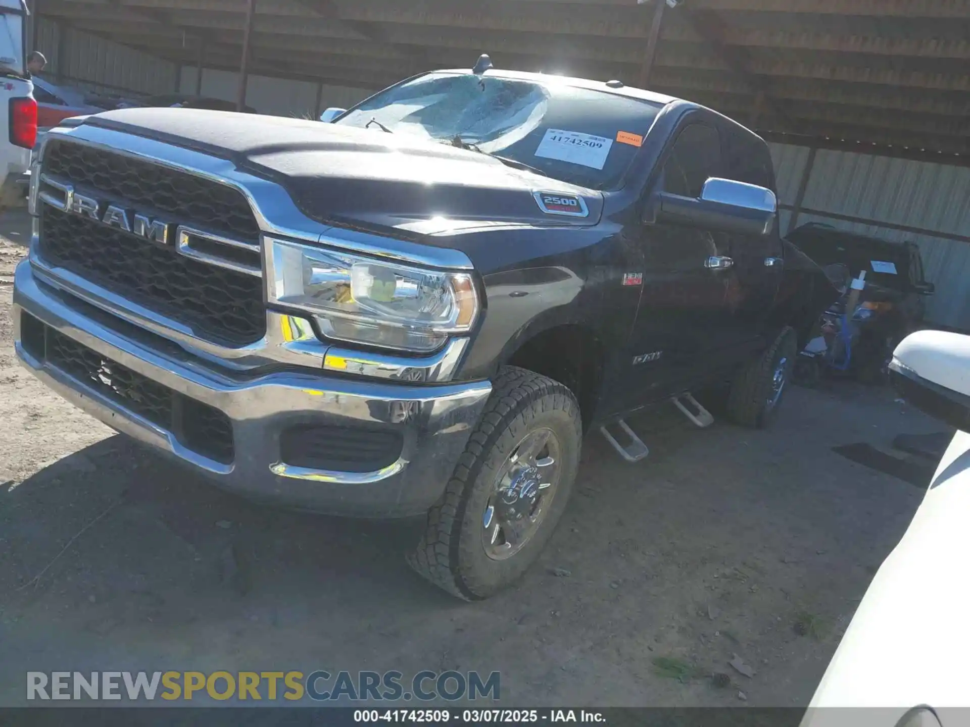 2 Photograph of a damaged car 3C6UR5CJ2MG573337 RAM 2500 2021