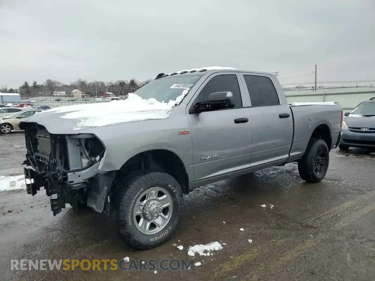 1 Photograph of a damaged car 3C6UR5CJ7MG582518 RAM 2500 2021