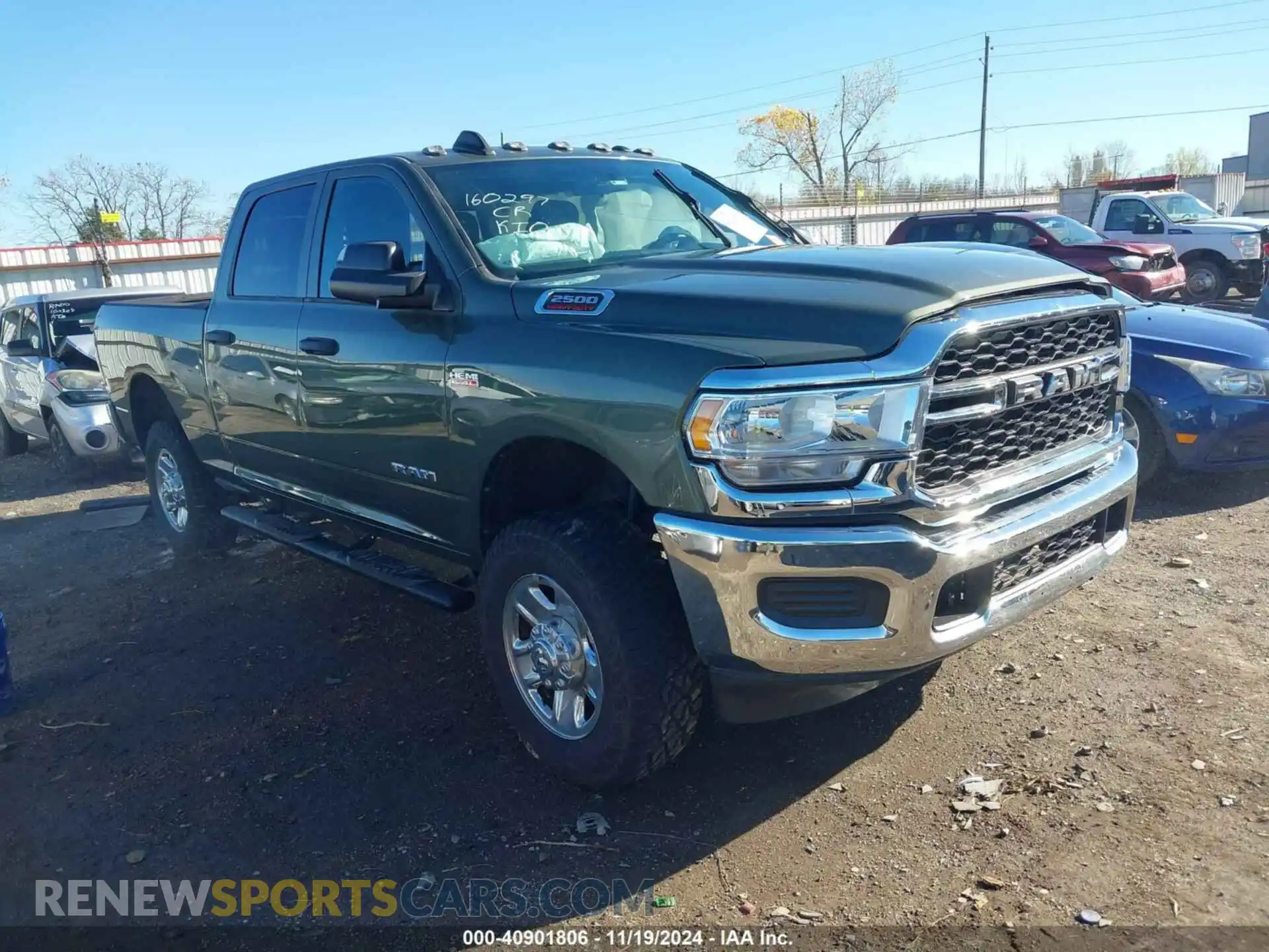 1 Photograph of a damaged car 3C6UR5CJXMG560559 RAM 2500 2021