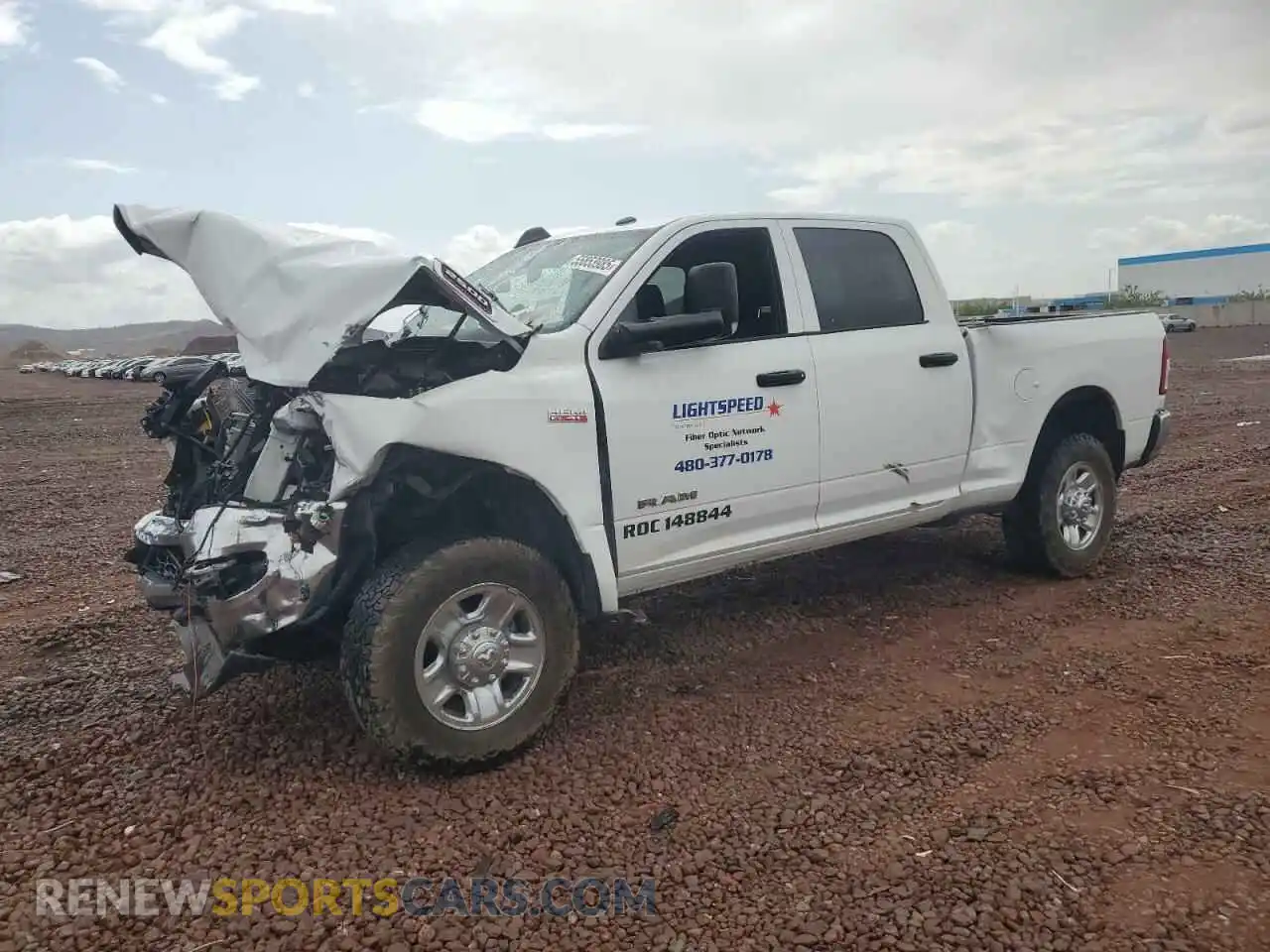 1 Photograph of a damaged car 3C6UR5CJXMG672598 RAM 2500 2021