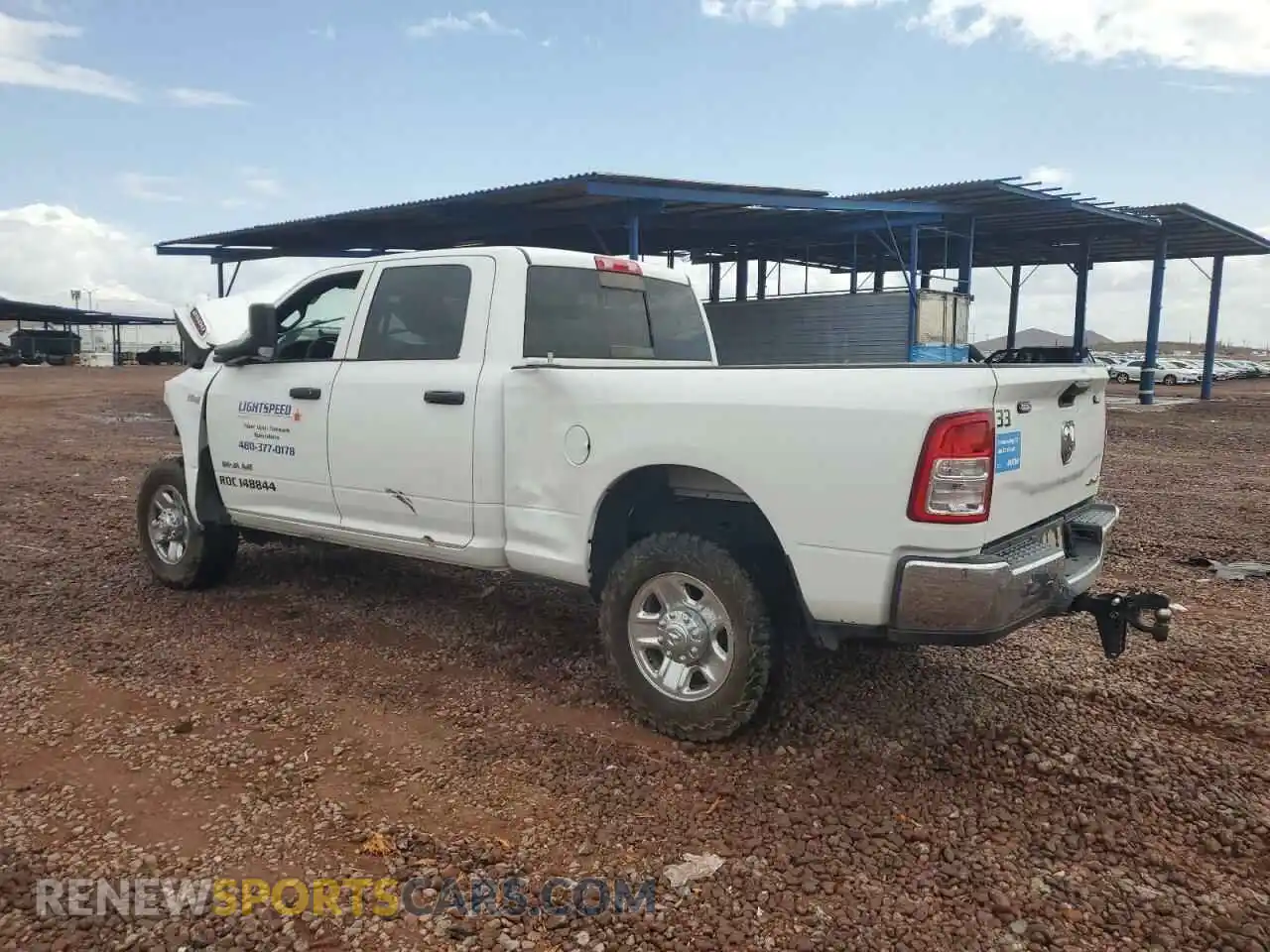 2 Photograph of a damaged car 3C6UR5CJXMG672598 RAM 2500 2021