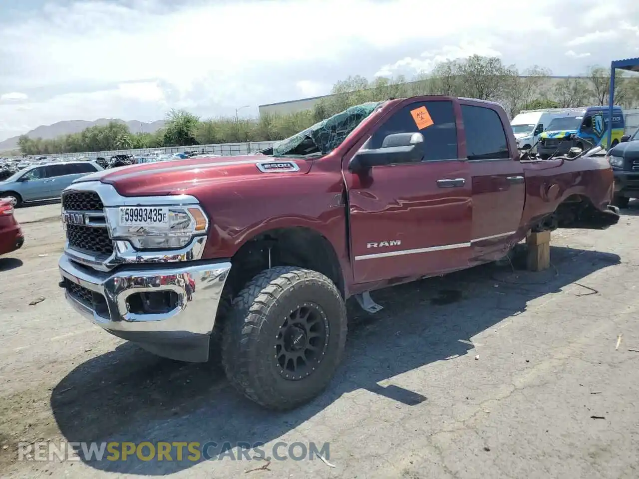1 Photograph of a damaged car 3C6UR5CL4MG697059 RAM 2500 2021