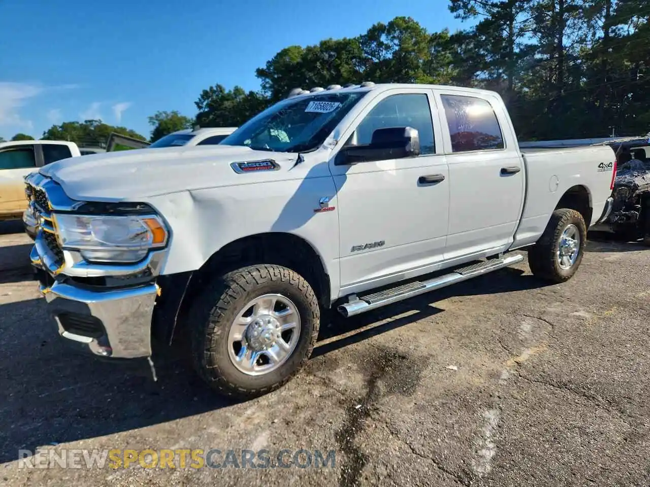 1 Photograph of a damaged car 3C6UR5CL5MG629787 RAM 2500 2021