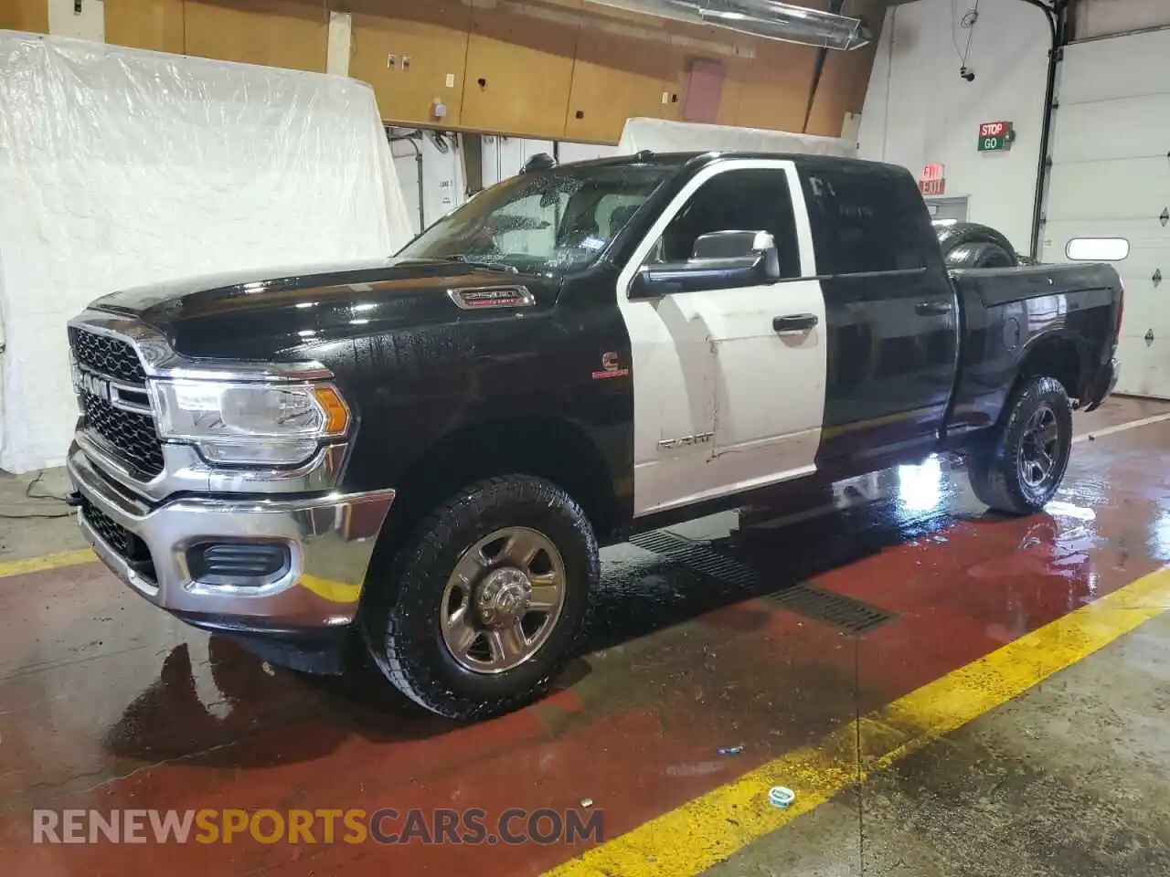 1 Photograph of a damaged car 3C6UR5CL7MG584058 RAM 2500 2021