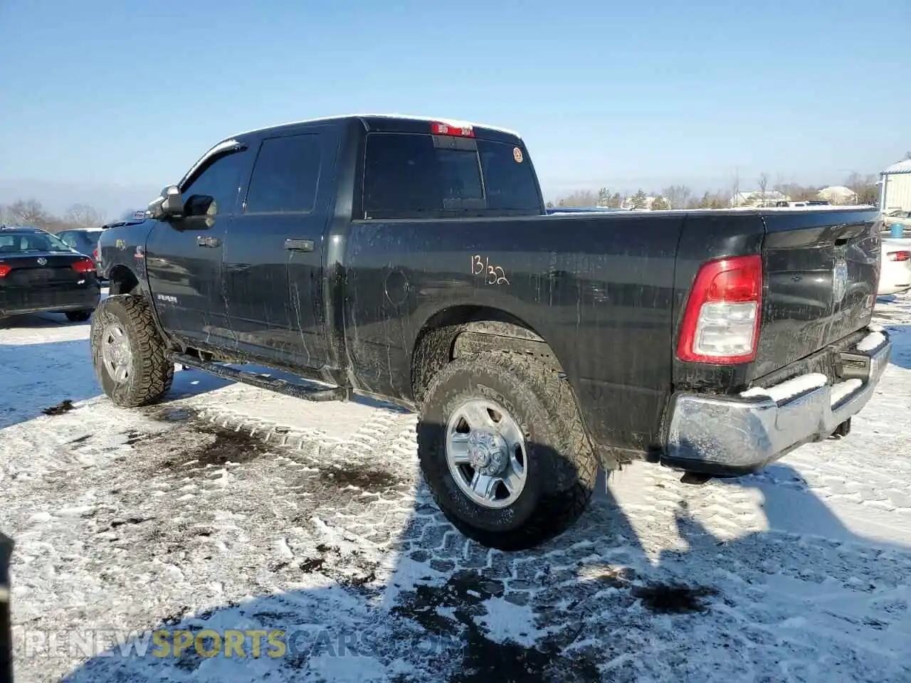 2 Photograph of a damaged car 3C6UR5CL8MG609050 RAM 2500 2021