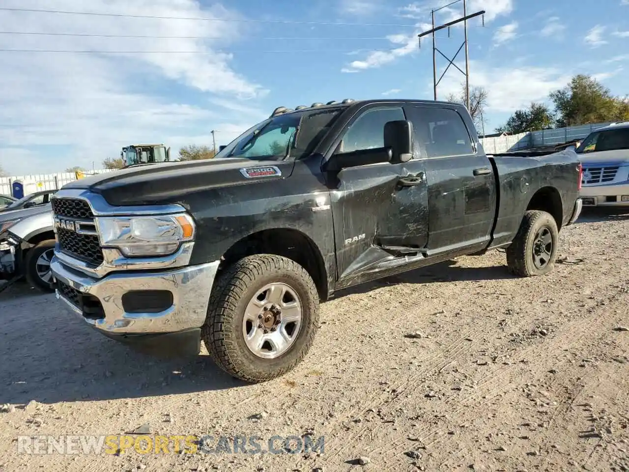 1 Photograph of a damaged car 3C6UR5CL8MG630884 RAM 2500 2021