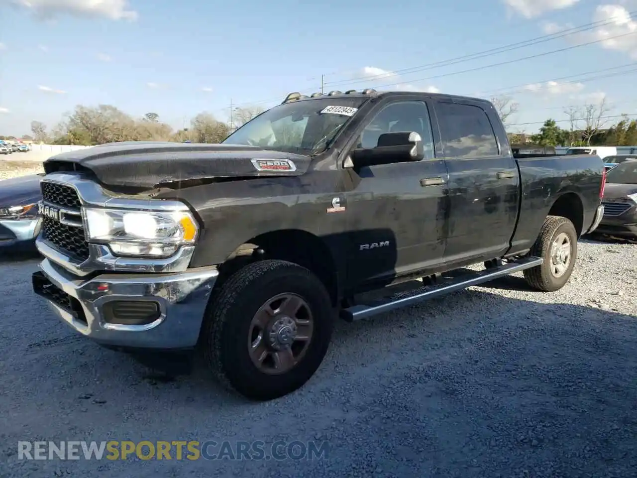 1 Photograph of a damaged car 3C6UR5CLXMG694652 RAM 2500 2021