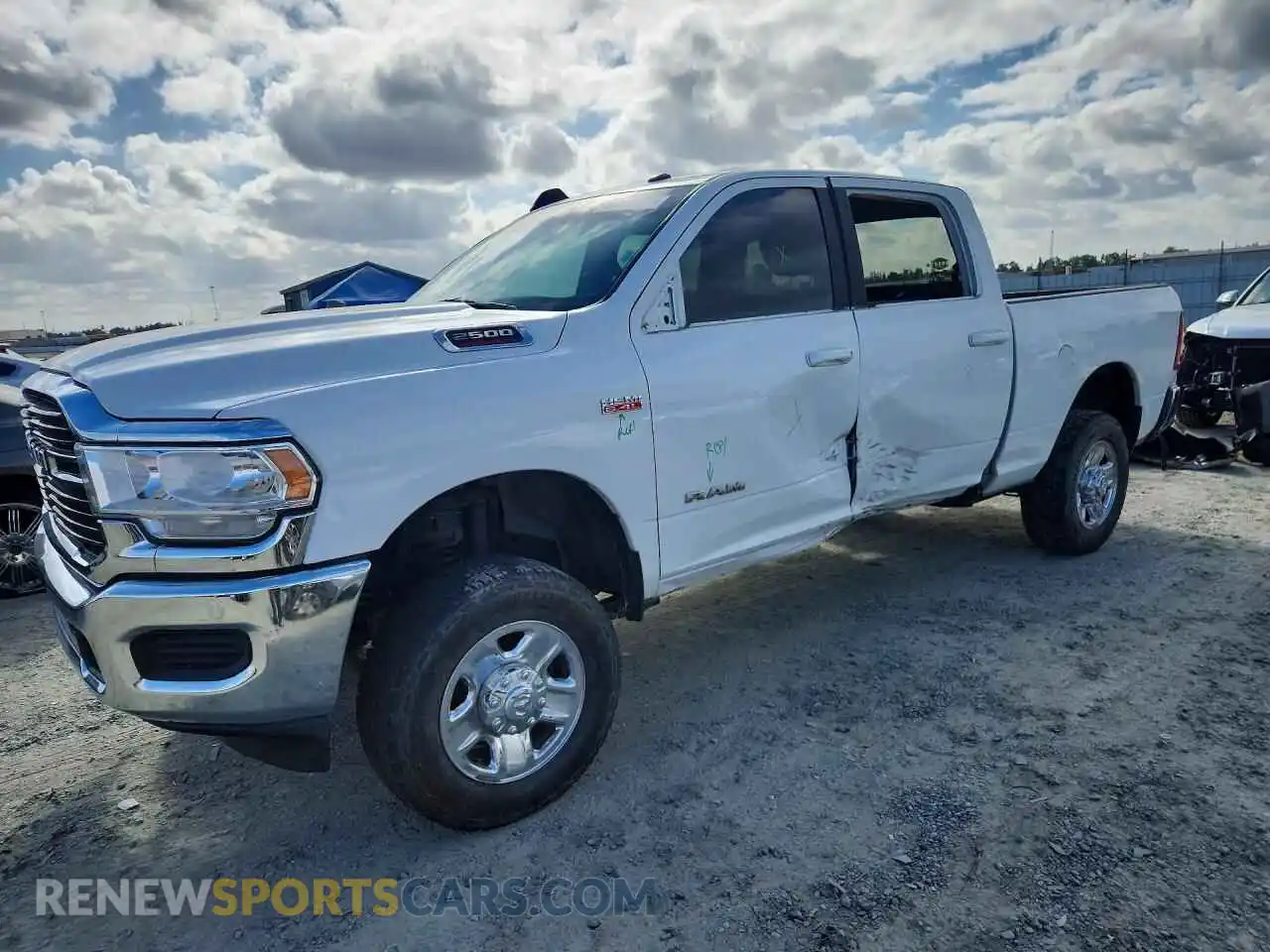 1 Photograph of a damaged car 3C6UR5DJ1MG555099 RAM 2500 2021