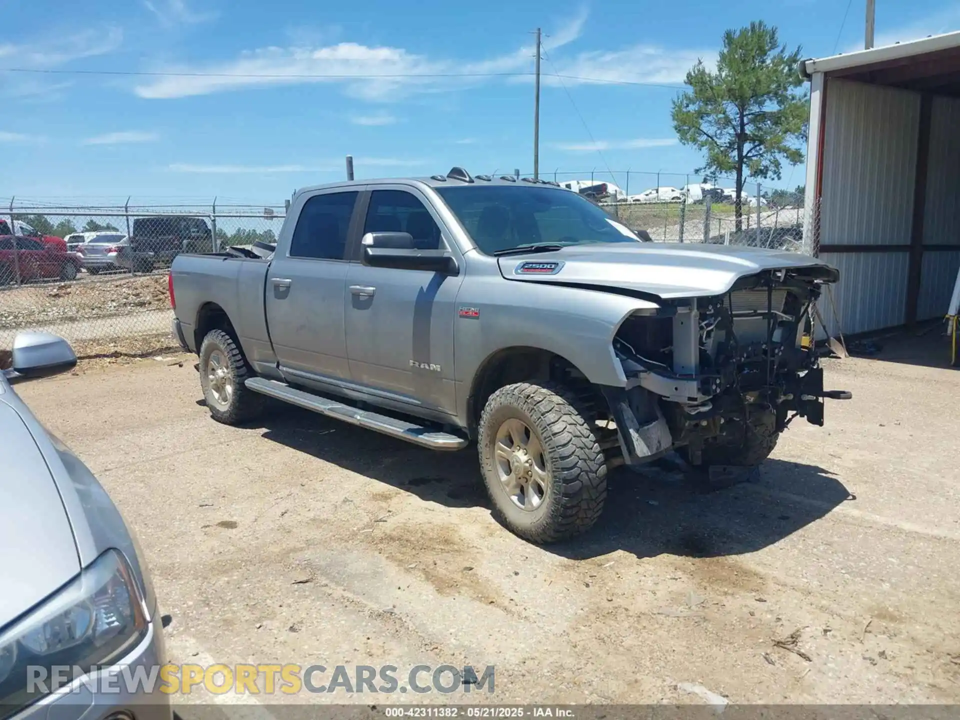 1 Photograph of a damaged car 3C6UR5DJ9MG590554 RAM 2500 2021