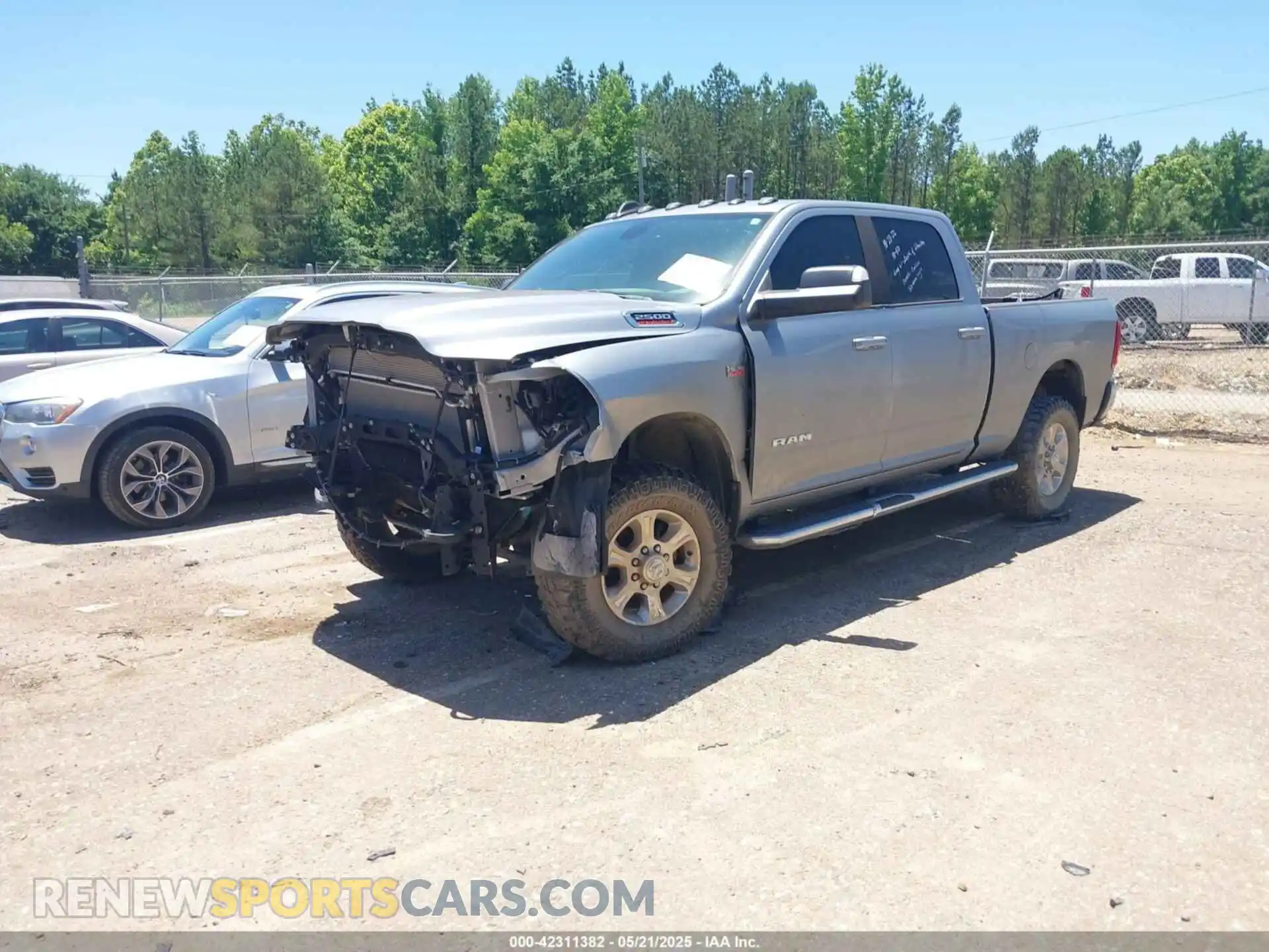 2 Photograph of a damaged car 3C6UR5DJ9MG590554 RAM 2500 2021