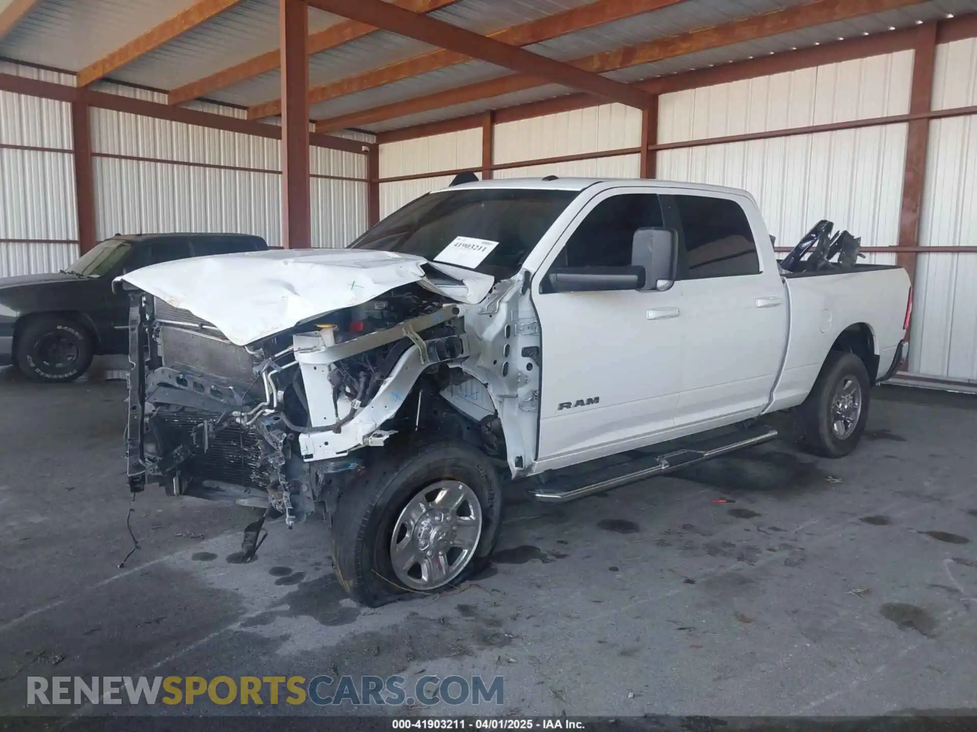 2 Photograph of a damaged car 3C6UR5DL0MG653459 RAM 2500 2021