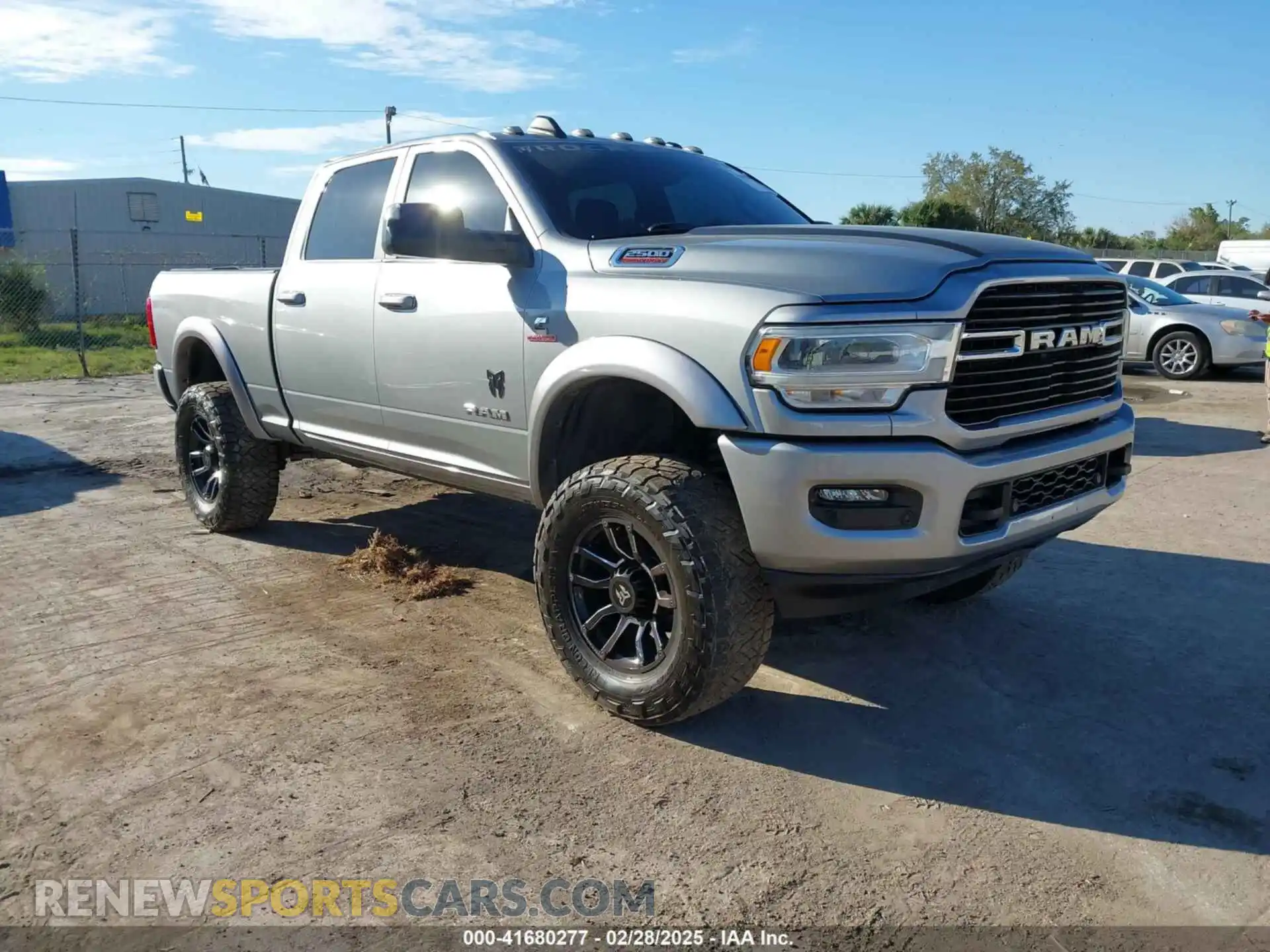 1 Photograph of a damaged car 3C6UR5DL0MG659682 RAM 2500 2021