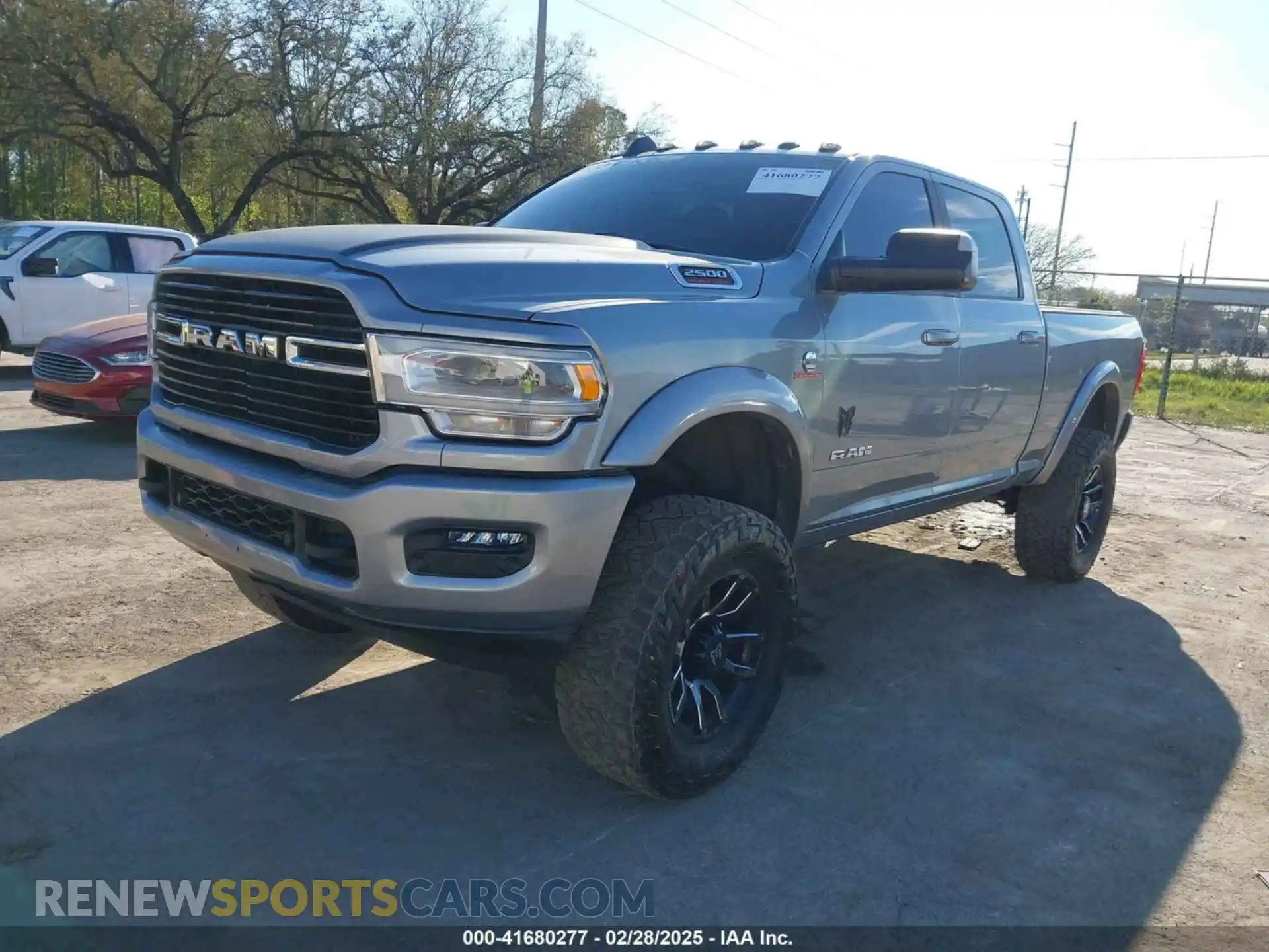 2 Photograph of a damaged car 3C6UR5DL0MG659682 RAM 2500 2021