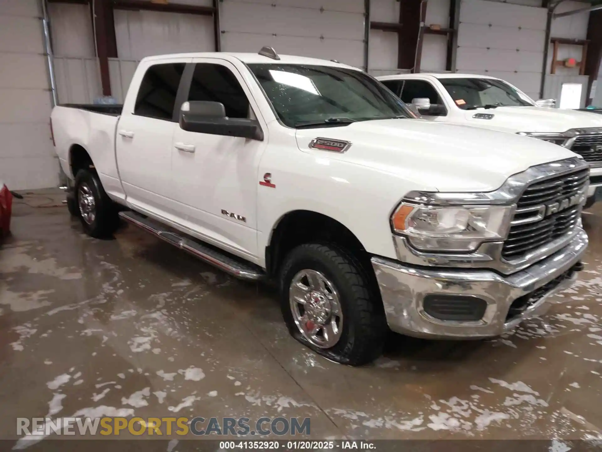 1 Photograph of a damaged car 3C6UR5DL1MG605601 RAM 2500 2021