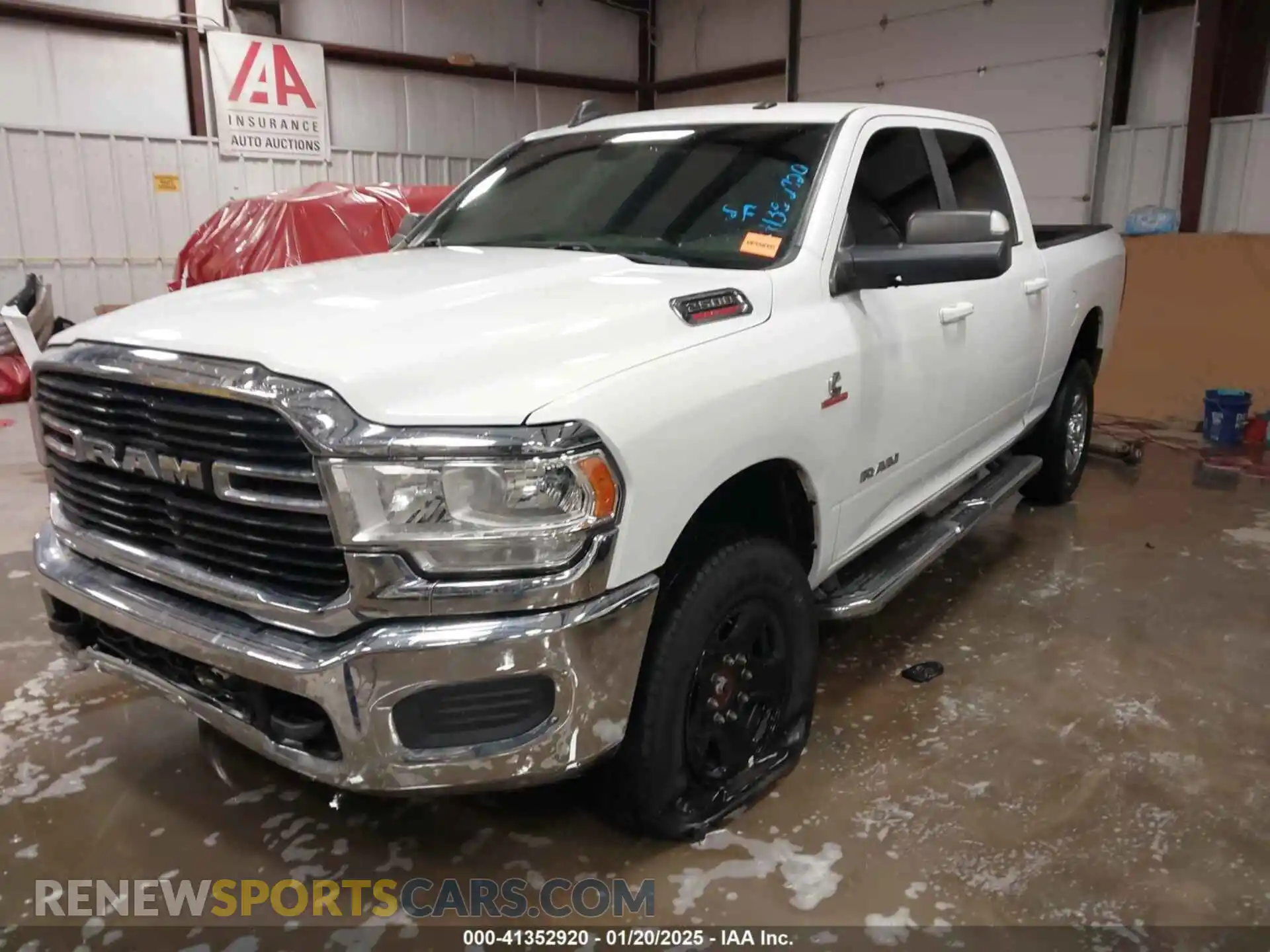 2 Photograph of a damaged car 3C6UR5DL1MG605601 RAM 2500 2021