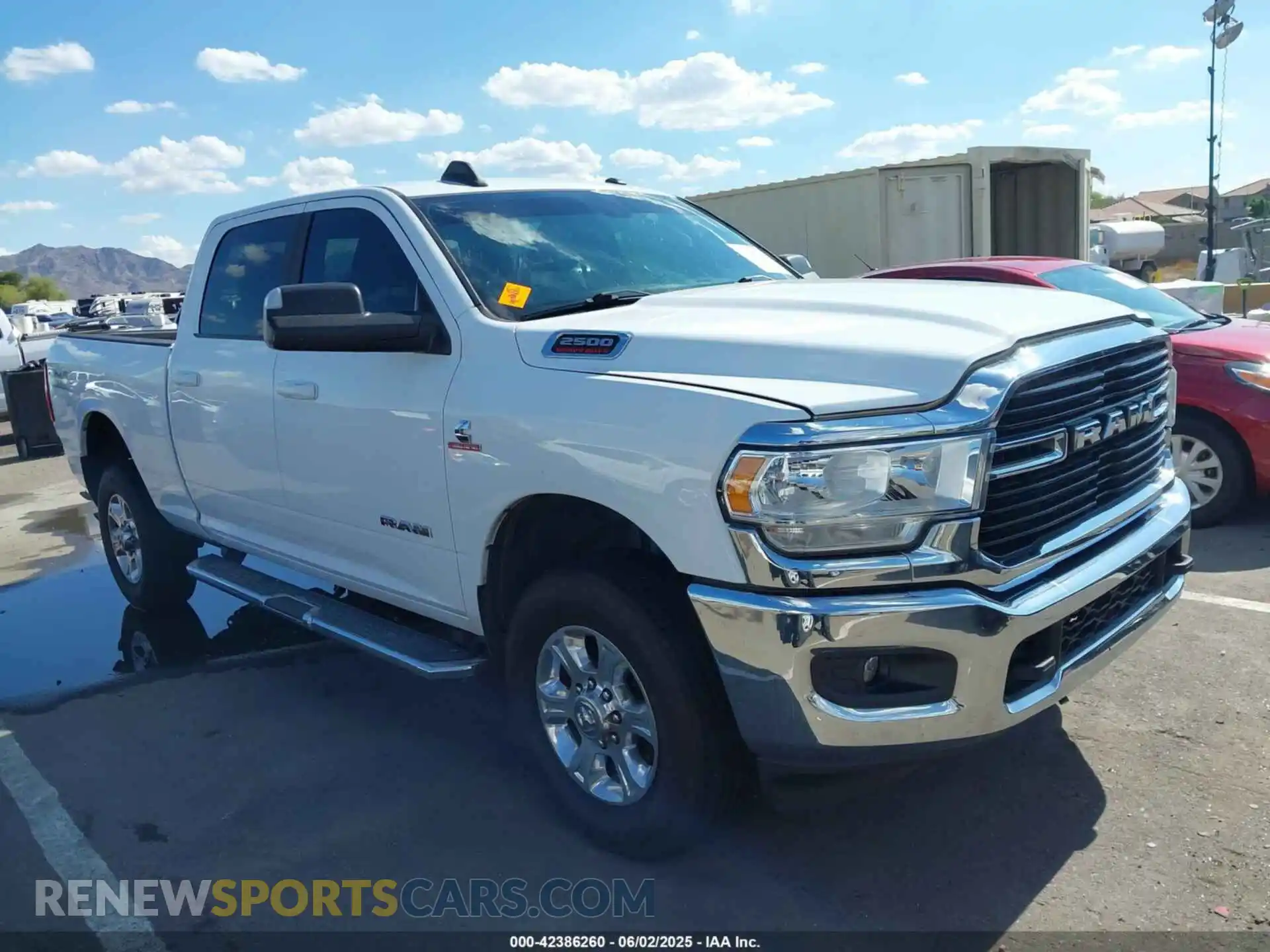 1 Photograph of a damaged car 3C6UR5DL1MG676863 RAM 2500 2021