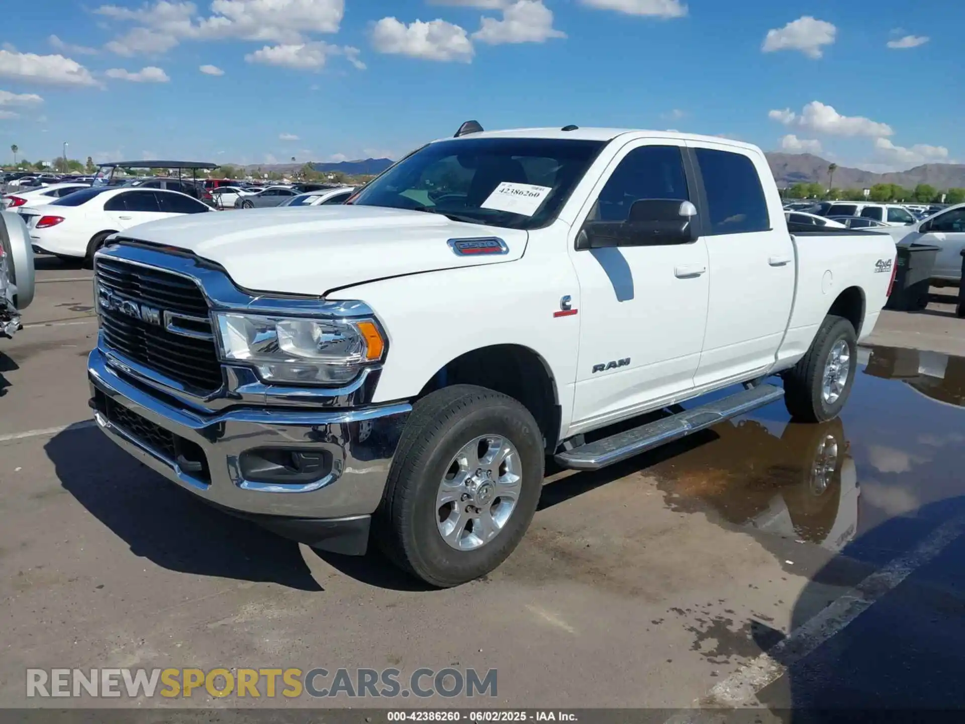 2 Photograph of a damaged car 3C6UR5DL1MG676863 RAM 2500 2021