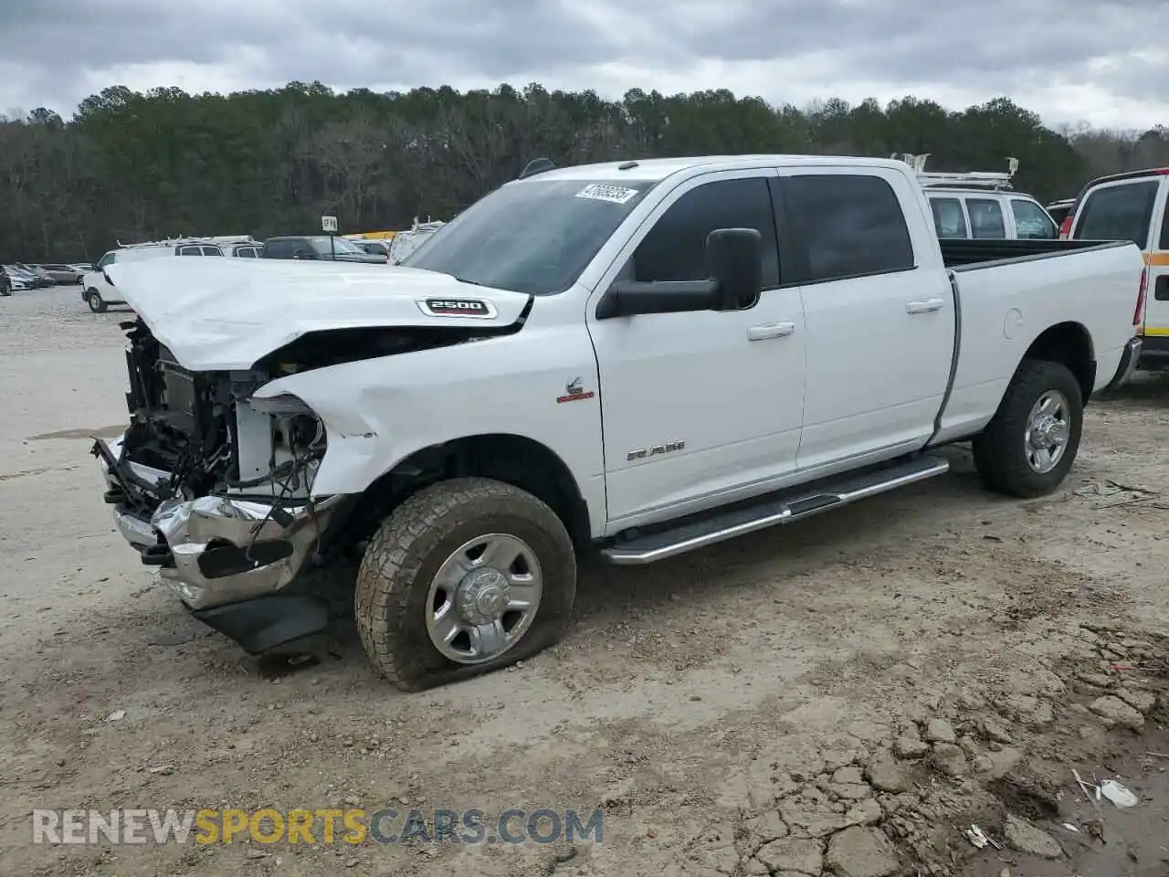 1 Photograph of a damaged car 3C6UR5DL3MG509100 RAM 2500 2021