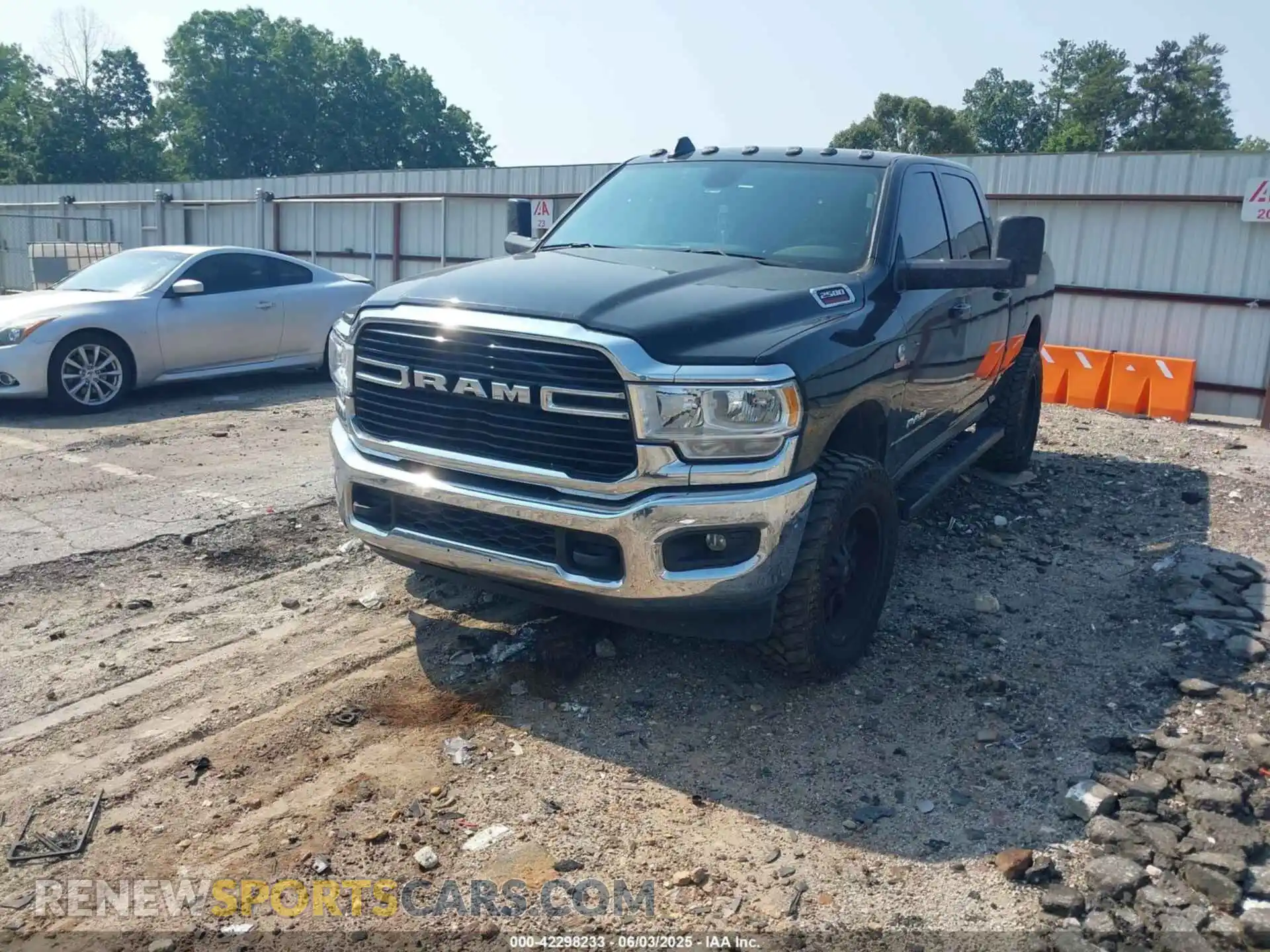 2 Photograph of a damaged car 3C6UR5DL3MG610847 RAM 2500 2021