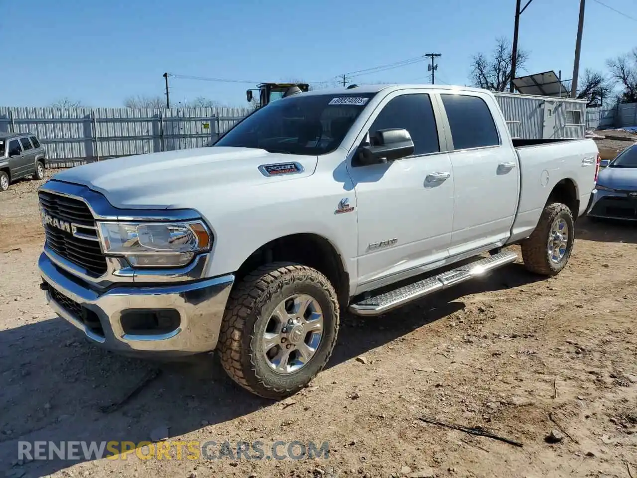 1 Photograph of a damaged car 3C6UR5DL3MG656159 RAM 2500 2021
