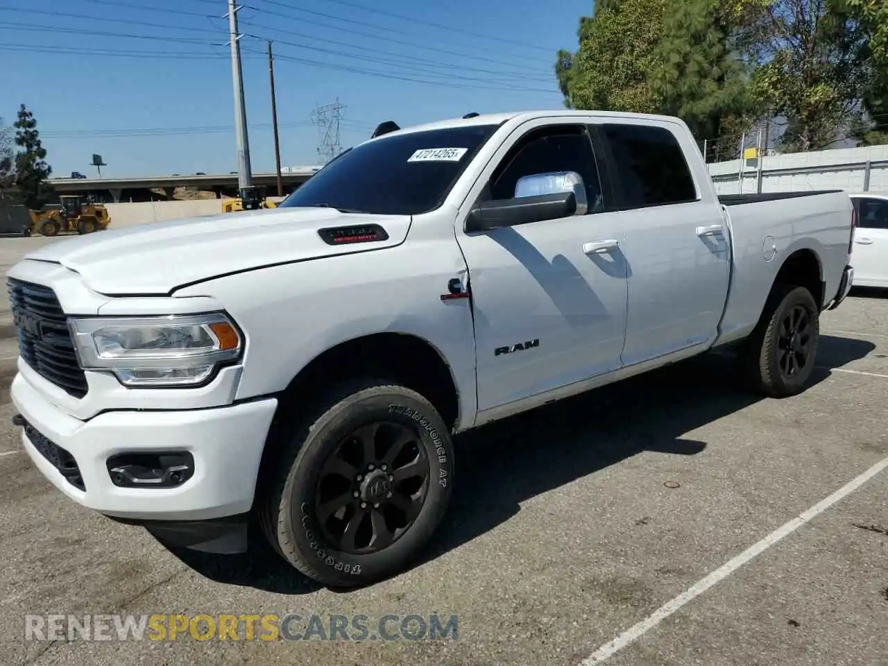 1 Photograph of a damaged car 3C6UR5DL5MG633465 RAM 2500 2021