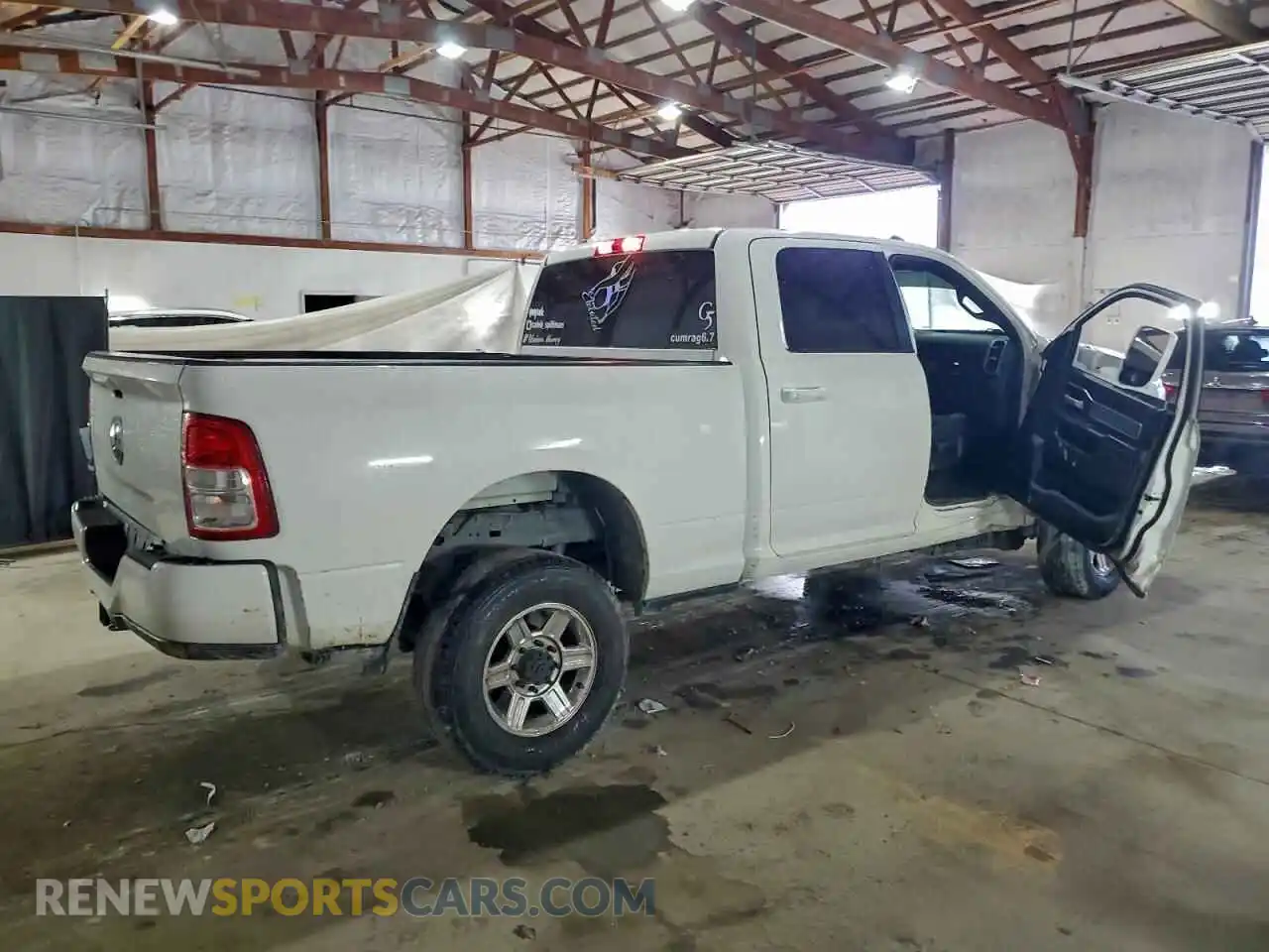 3 Photograph of a damaged car 3C6UR5DL7MG679539 RAM 2500 2021