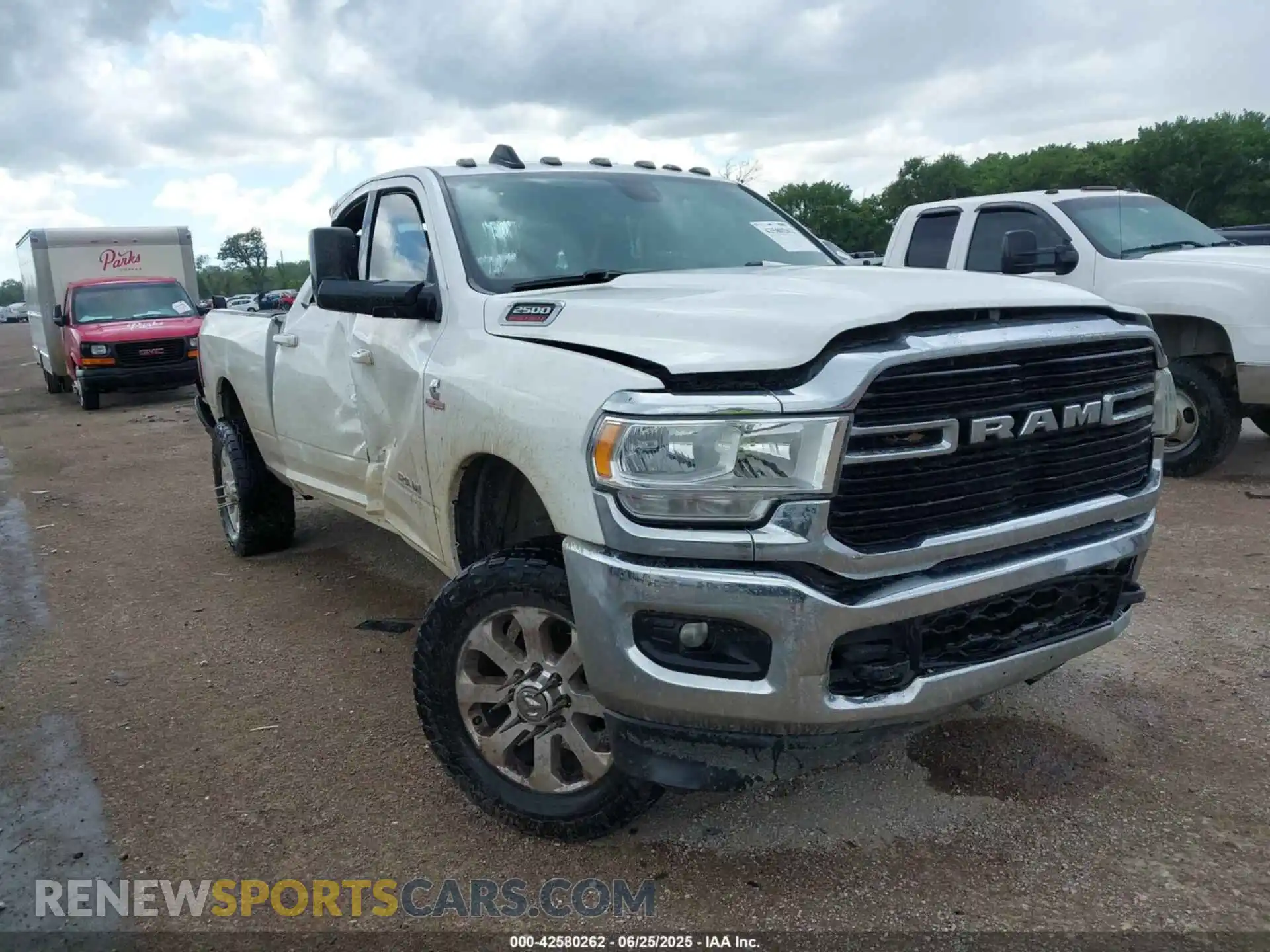 1 Photograph of a damaged car 3C6UR5DLXMG516948 RAM 2500 2021