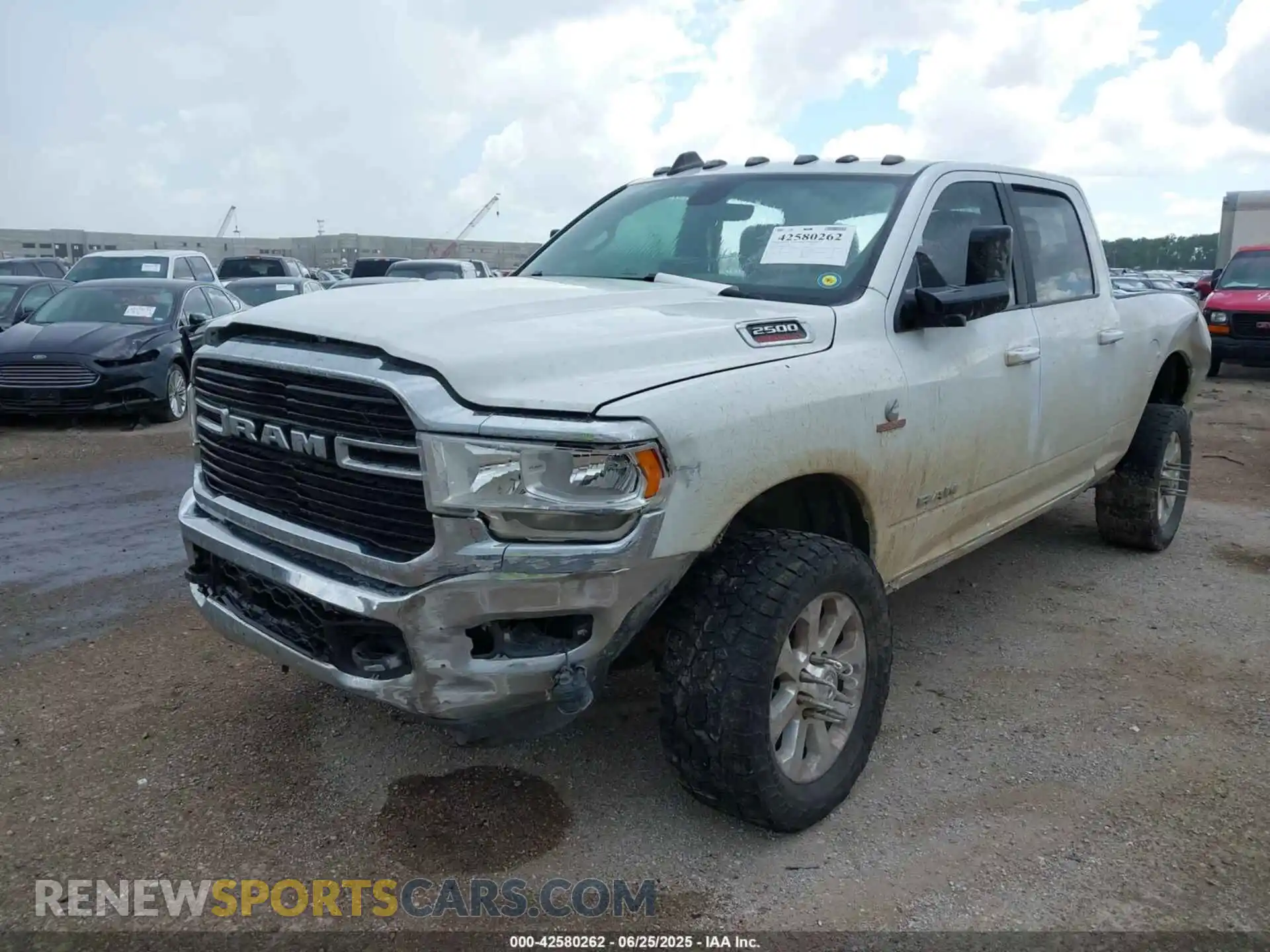 2 Photograph of a damaged car 3C6UR5DLXMG516948 RAM 2500 2021