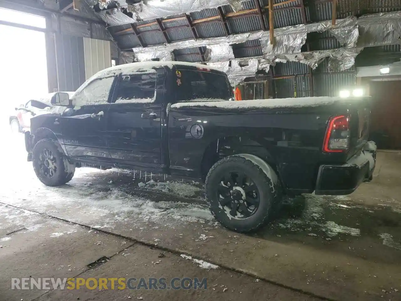 2 Photograph of a damaged car 3C6UR5DLXMG580648 RAM 2500 2021