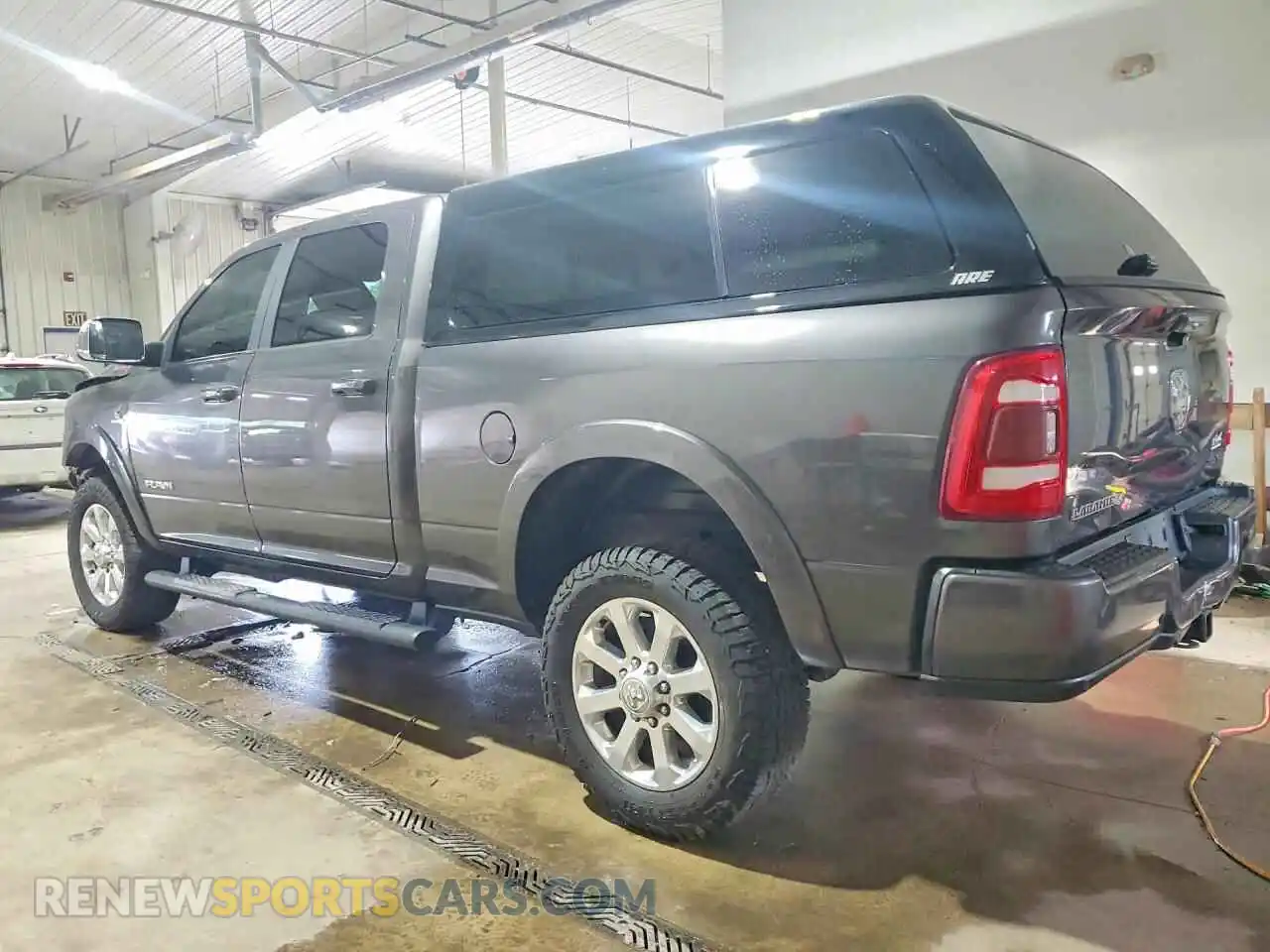 2 Photograph of a damaged car 3C6UR5FL0MG683154 RAM 2500 2021