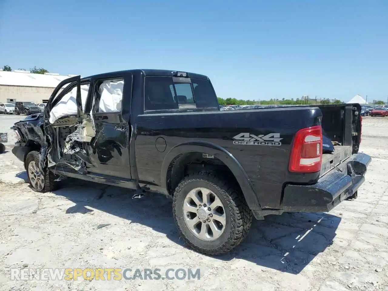 2 Photograph of a damaged car 3C6UR5FL2MG611033 RAM 2500 2021
