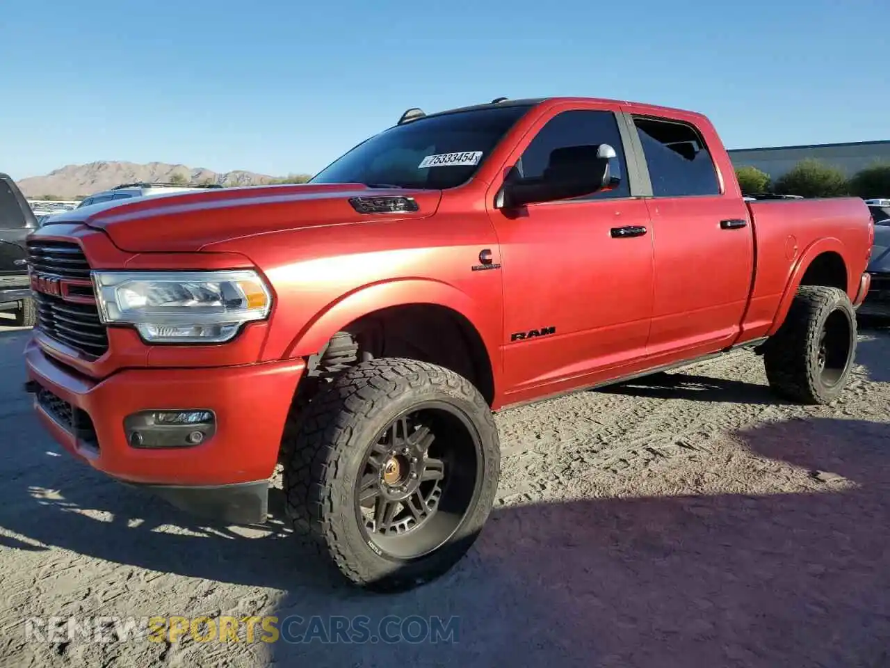 1 Photograph of a damaged car 3C6UR5FL6MG594415 RAM 2500 2021