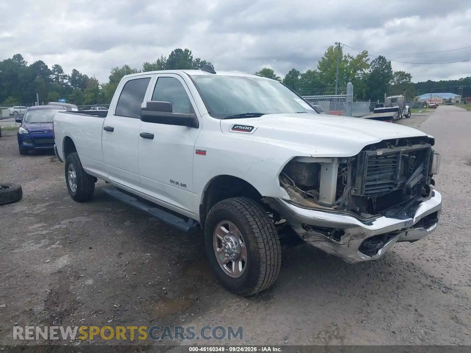 1 Photograph of a damaged car 3C6UR5HJ0MG582353 RAM 2500 2021