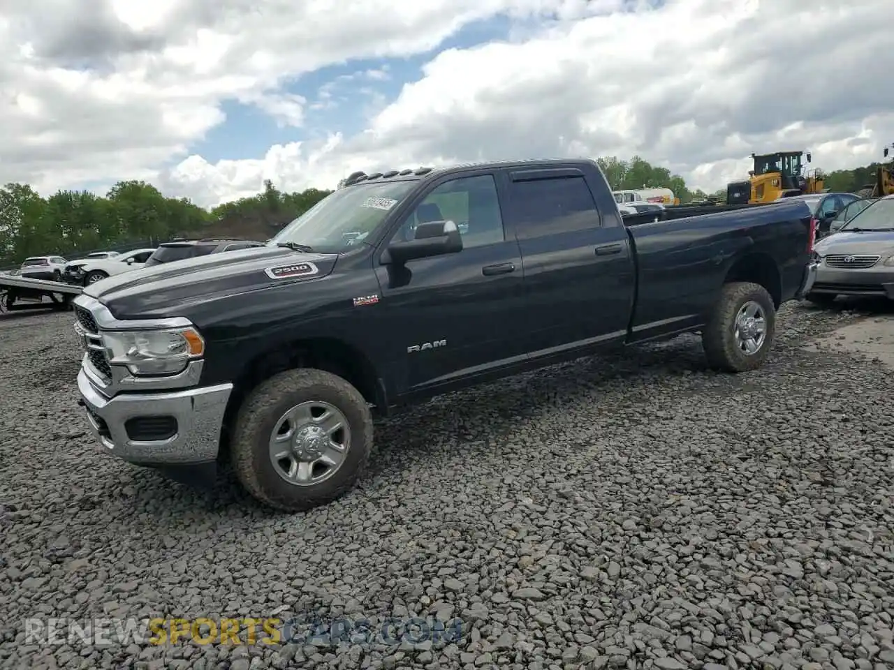 1 Photograph of a damaged car 3C6UR5HJXMG632935 RAM 2500 2021
