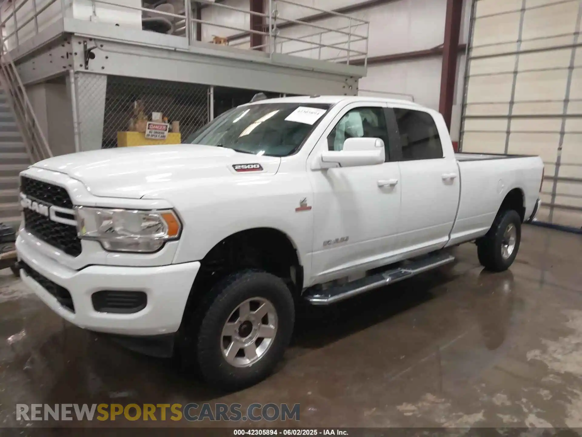 2 Photograph of a damaged car 3C6UR5JL5MG554642 RAM 2500 2021