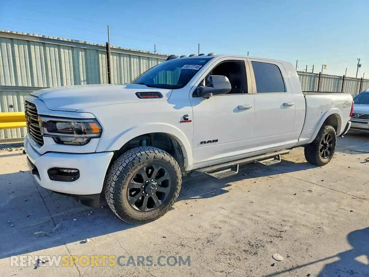 1 Photograph of a damaged car 3C6UR5NL8MG524352 RAM 2500 2021
