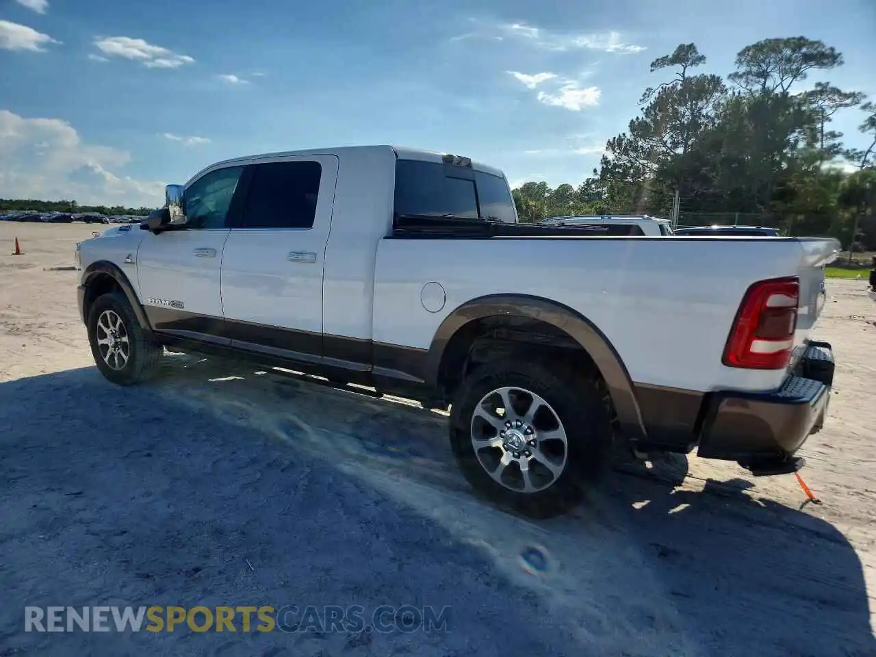 2 Photograph of a damaged car 3C6UR5PL2MG675457 RAM 2500 2021