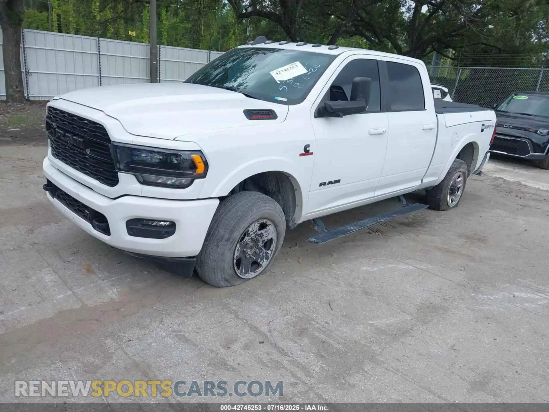 2 Photograph of a damaged car 3C6UR5SL8MG531354 RAM 2500 2021