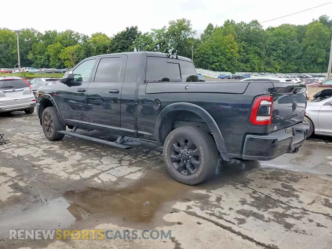 2 Photograph of a damaged car 3C6UR5TL3MG606010 RAM 2500 2021
